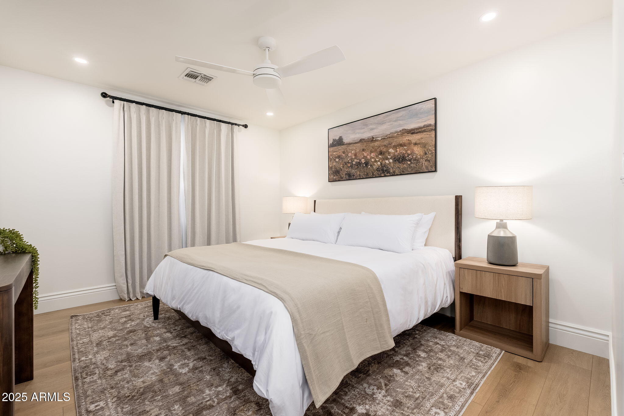 4030 East Fairmount Avenue Phoenix, AZ 85018 - Photo 14 of 23 a bedroom with a bed and a night stand