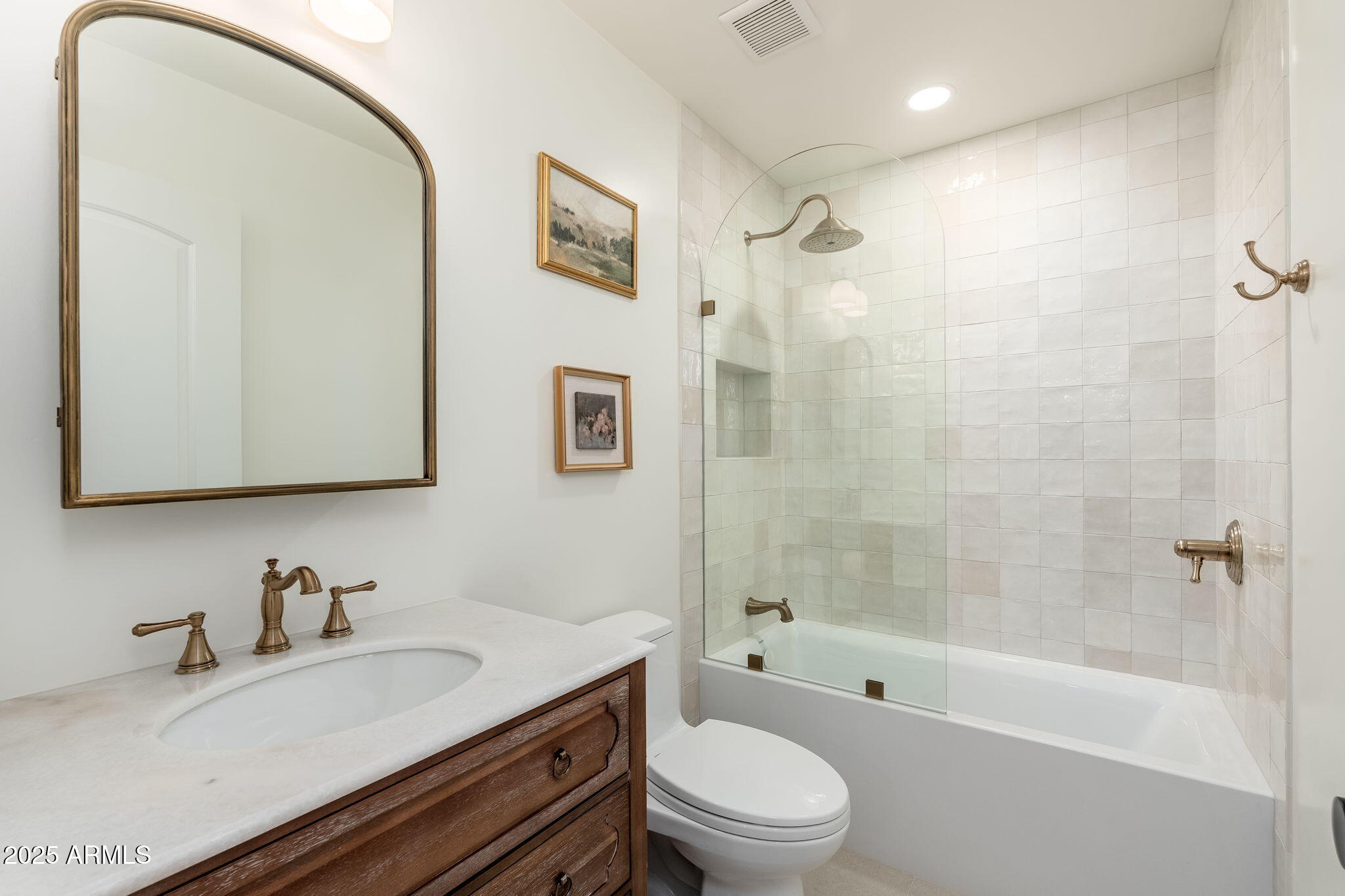 4030 East Fairmount Avenue Phoenix, AZ 85018 - Photo 16 of 23 a bathroom with a granite countertop sink a toilet a mirror and shower
