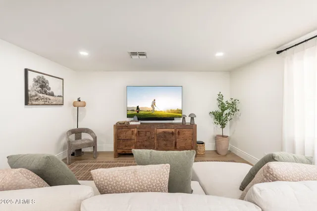 a living room with furniture and a couch
