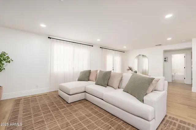 a living room with furniture and a couch