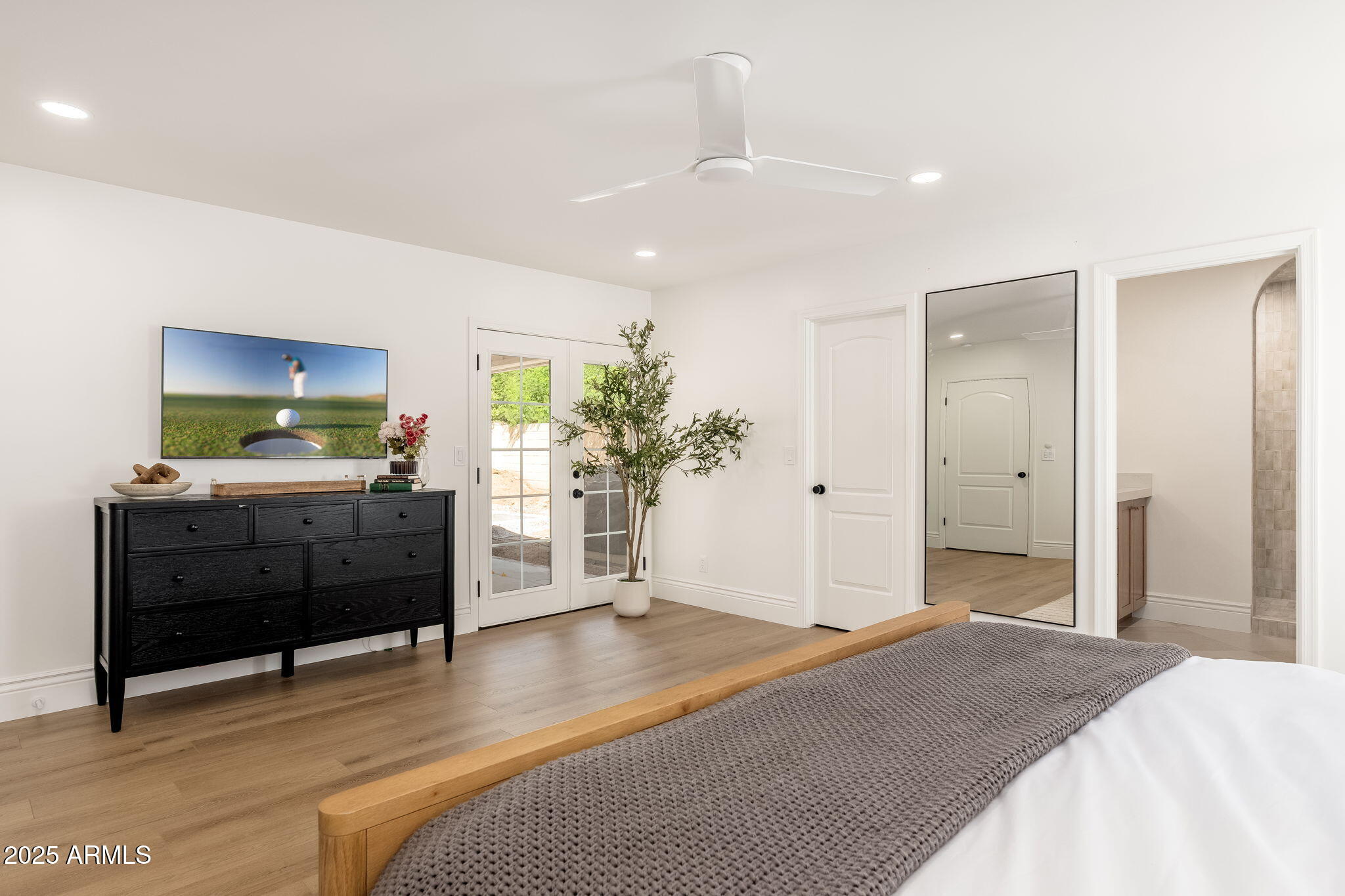 4030 East Fairmount Avenue Phoenix, AZ 85018 - Photo 19 of 23 a bedroom with furniture and a flat screen tv