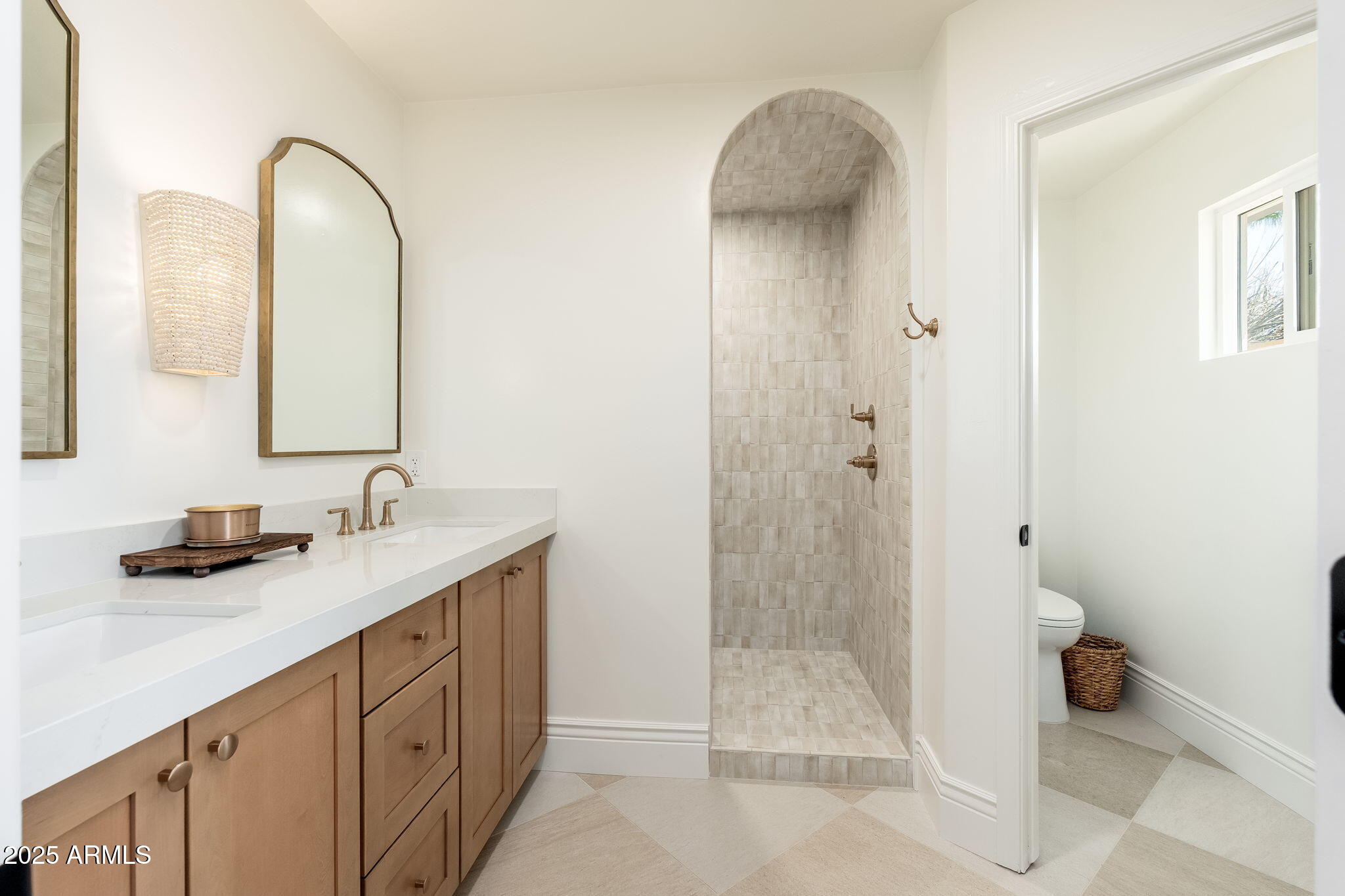 4030 East Fairmount Avenue Phoenix, AZ 85018 - Photo 21 of 23 a bathroom with a sink and a mirror