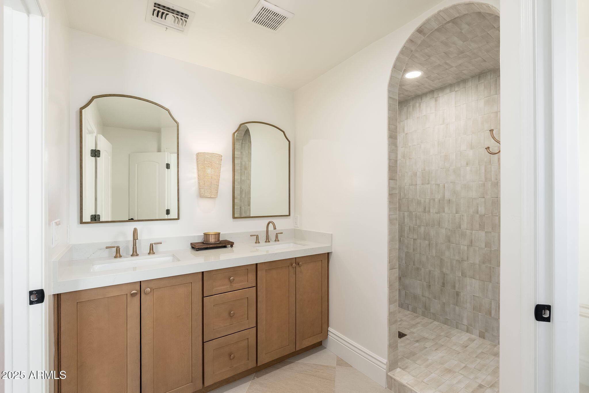 4030 East Fairmount Avenue Phoenix, AZ 85018 - Photo 22 of 23 a bathroom with a double vanity sink a mirror and shower