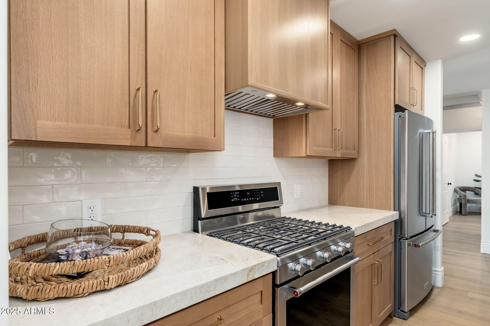 4030 East Fairmount Avenue Phoenix, AZ 85018 - Photo 6 of 23 a kitchen with stainless steel appliances granite countertop a stove a refrigerator and a white cabinets