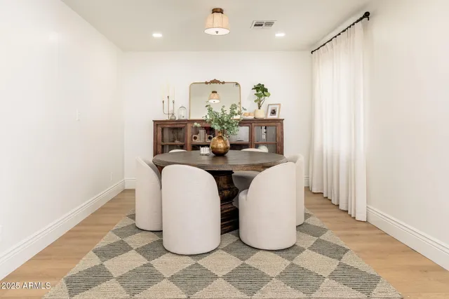 a view of a kitchen with natural light