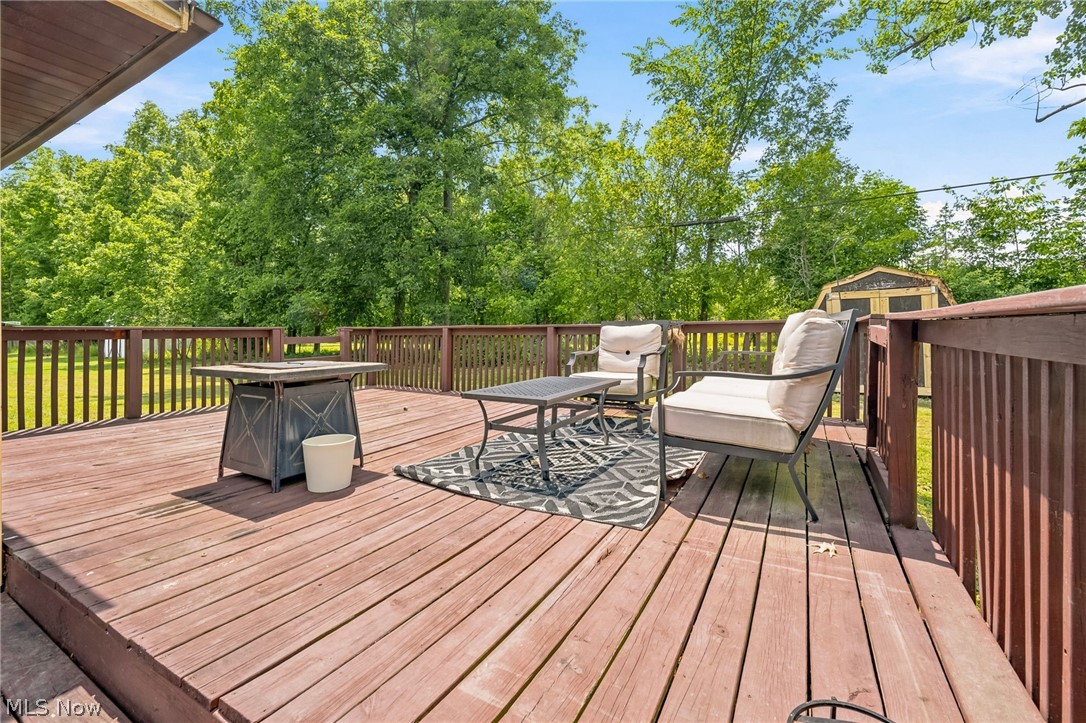 8160 Joyce Road Broadview Heights, OH 44147 - Photo 30 of 45 Expansive wood deck featuring a perimeter railing, overlooking a green landscape with mature trees
