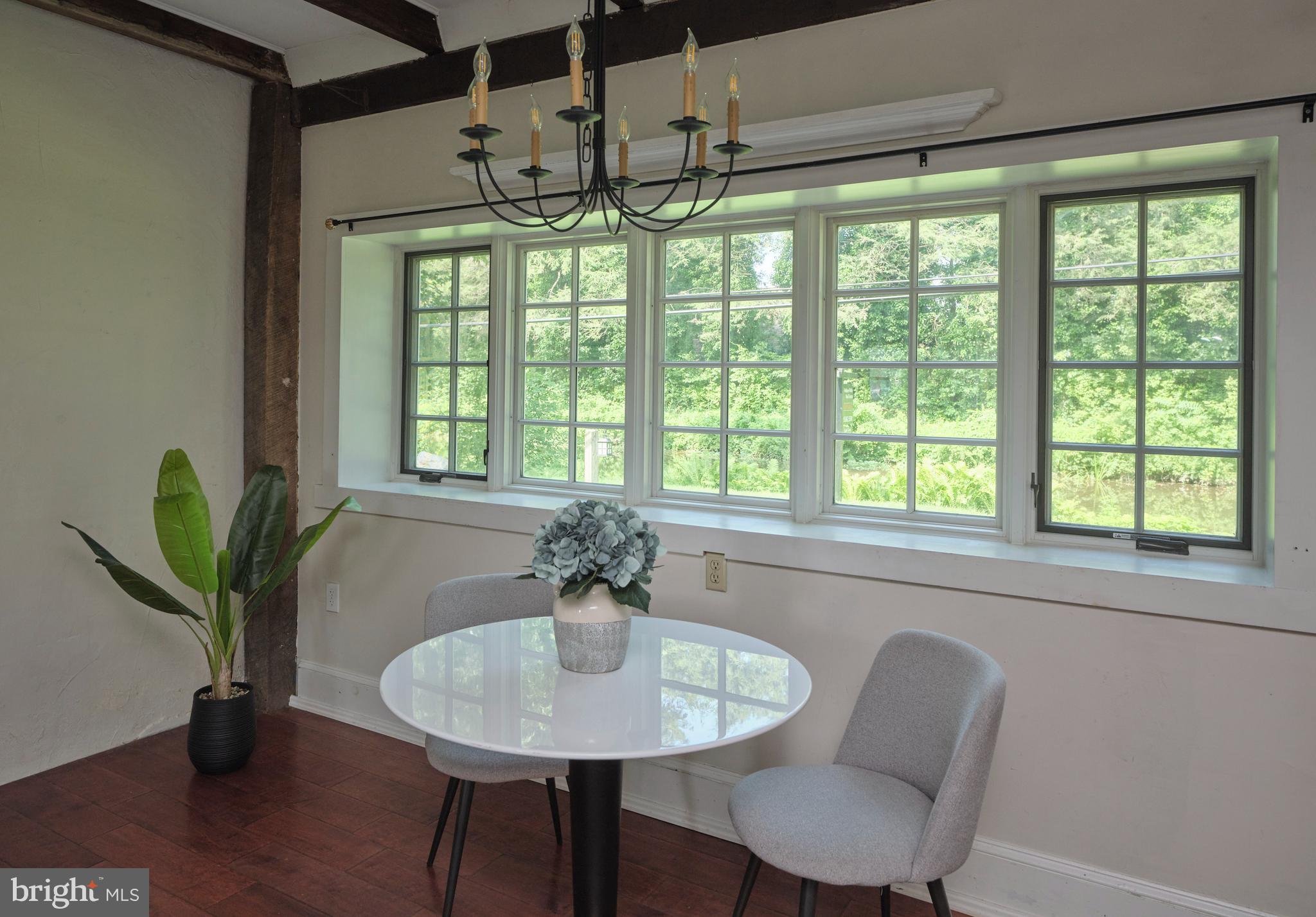 2598 River Road New Hope, PA 18938 - Photo 14 of 28 a view of a dining room with furniture window and wooden floor