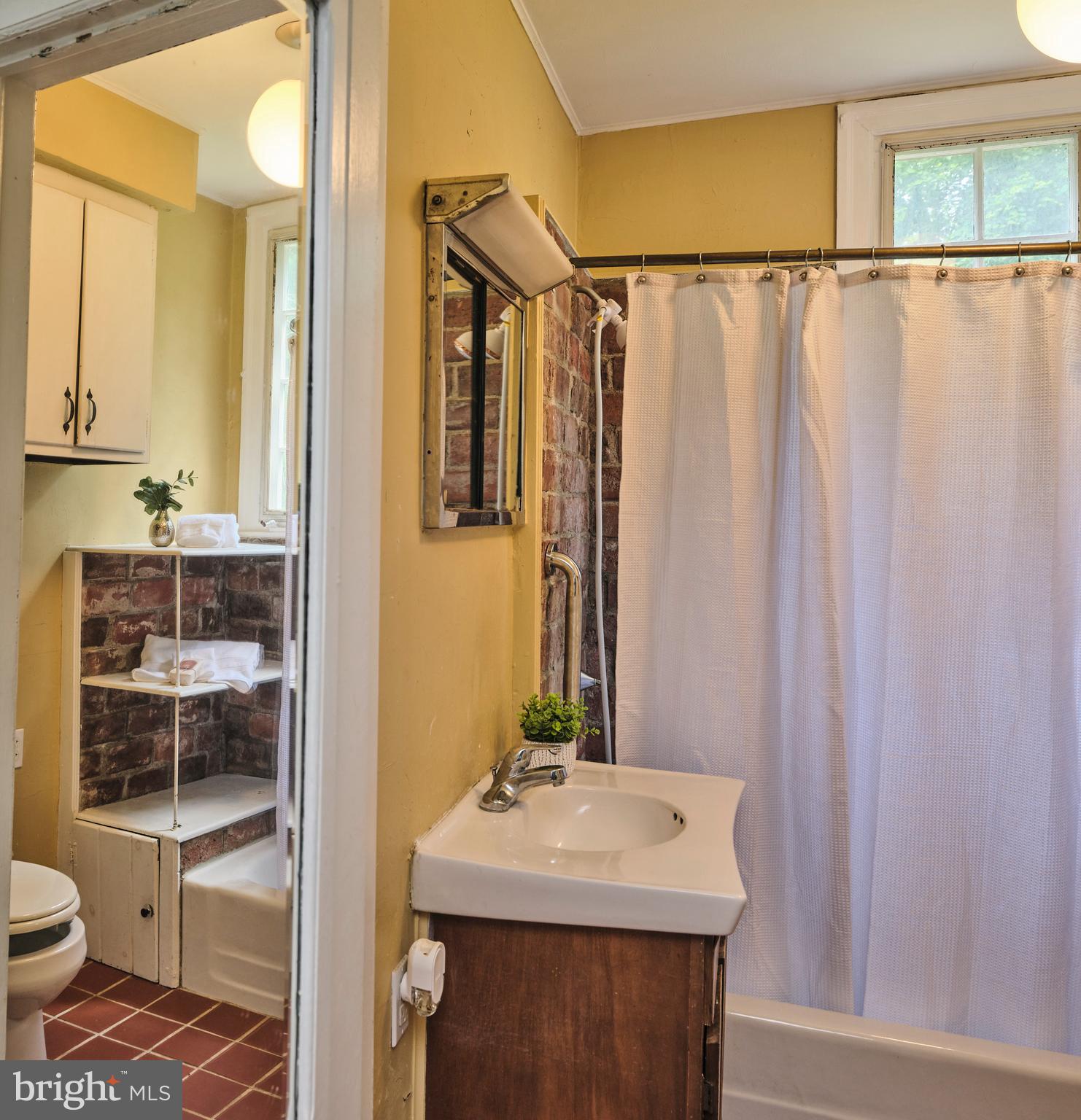 2598 River Road New Hope, PA 18938 - Photo 19 of 28 a bathroom with a sink and a mirror