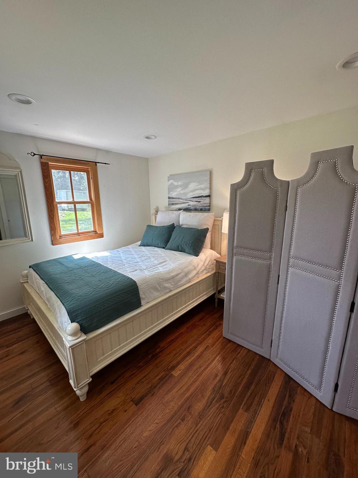 2598 River Road New Hope, PA 18938 - Photo 22 of 28 a bedroom with a bed and wooden floor
