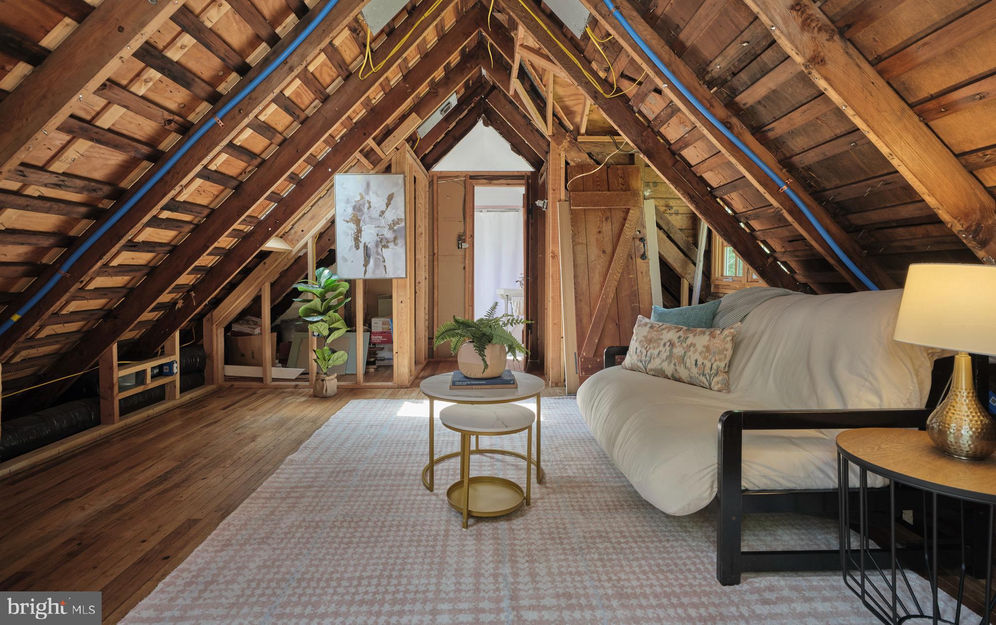 2598 River Road New Hope, PA 18938 - Photo 25 of 28 a living room with furniture a bed and a chandelier