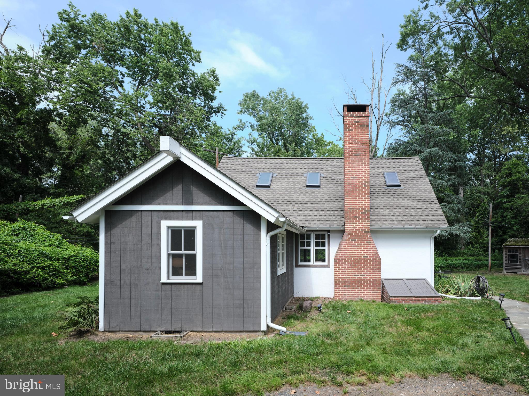 2598 River Road New Hope, PA 18938 - Photo 3 of 28 a front view of a house with a yard and trees