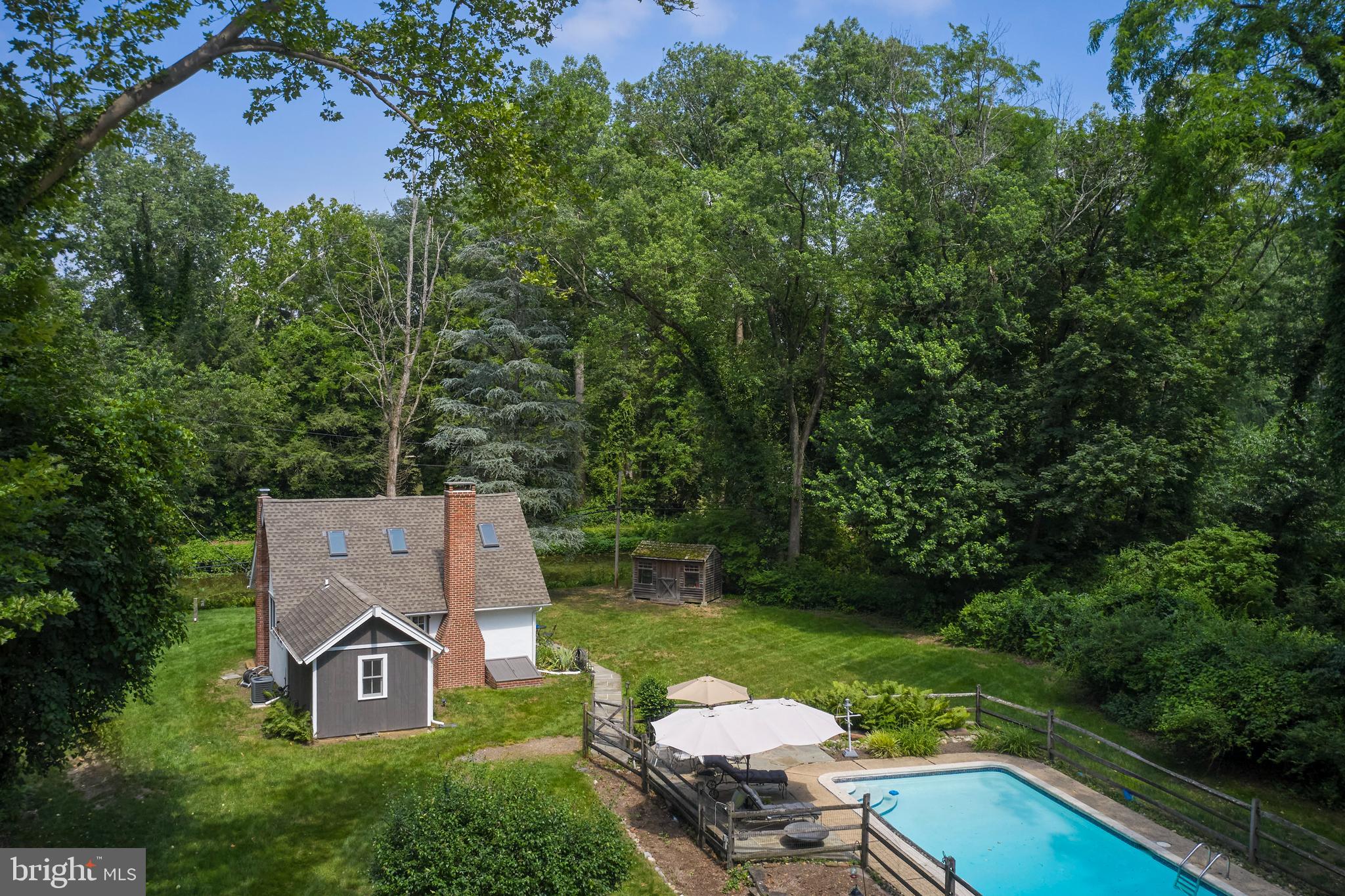 2598 River Road New Hope, PA 18938 - Photo 4 of 28 an aerial view of a house with garden space and trees all around