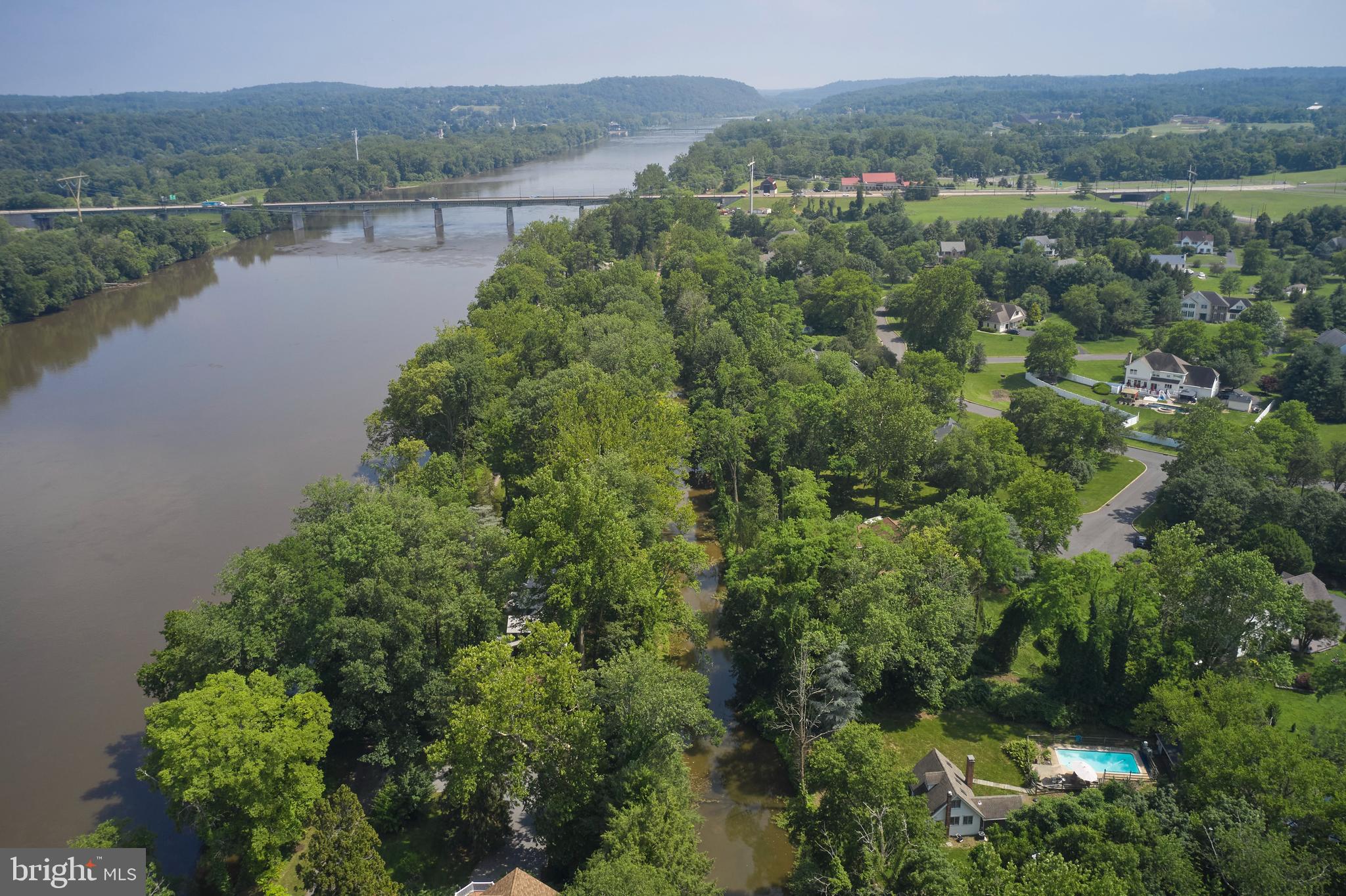 2598 River Road New Hope, PA 18938 - Photo 8 of 28 an aerial view of green landscape with trees houses and lake view