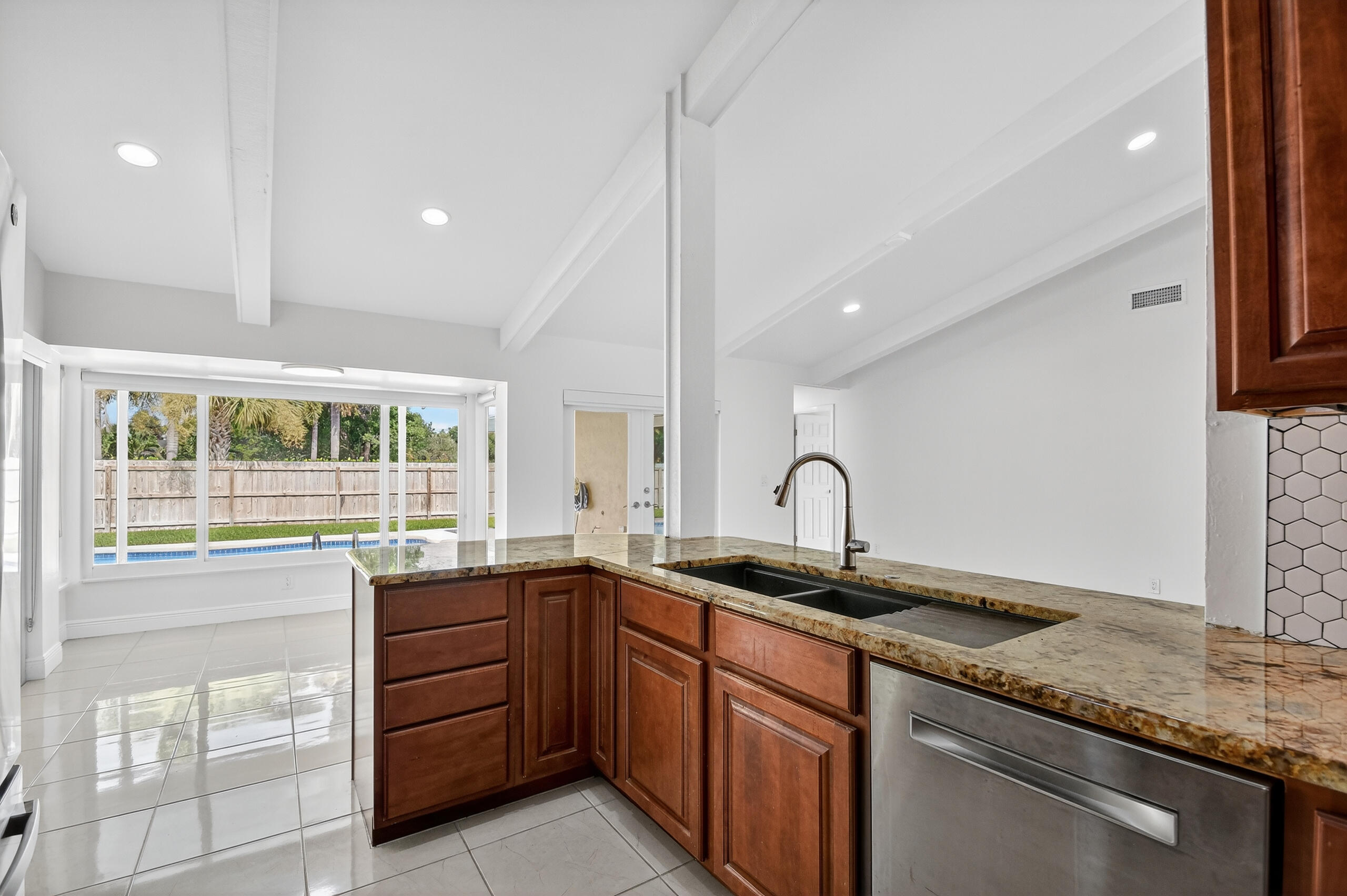 1877 Shower Tree Way Wellington, FL 33414 - Photo 16 of 53 a kitchen with a sink and a window