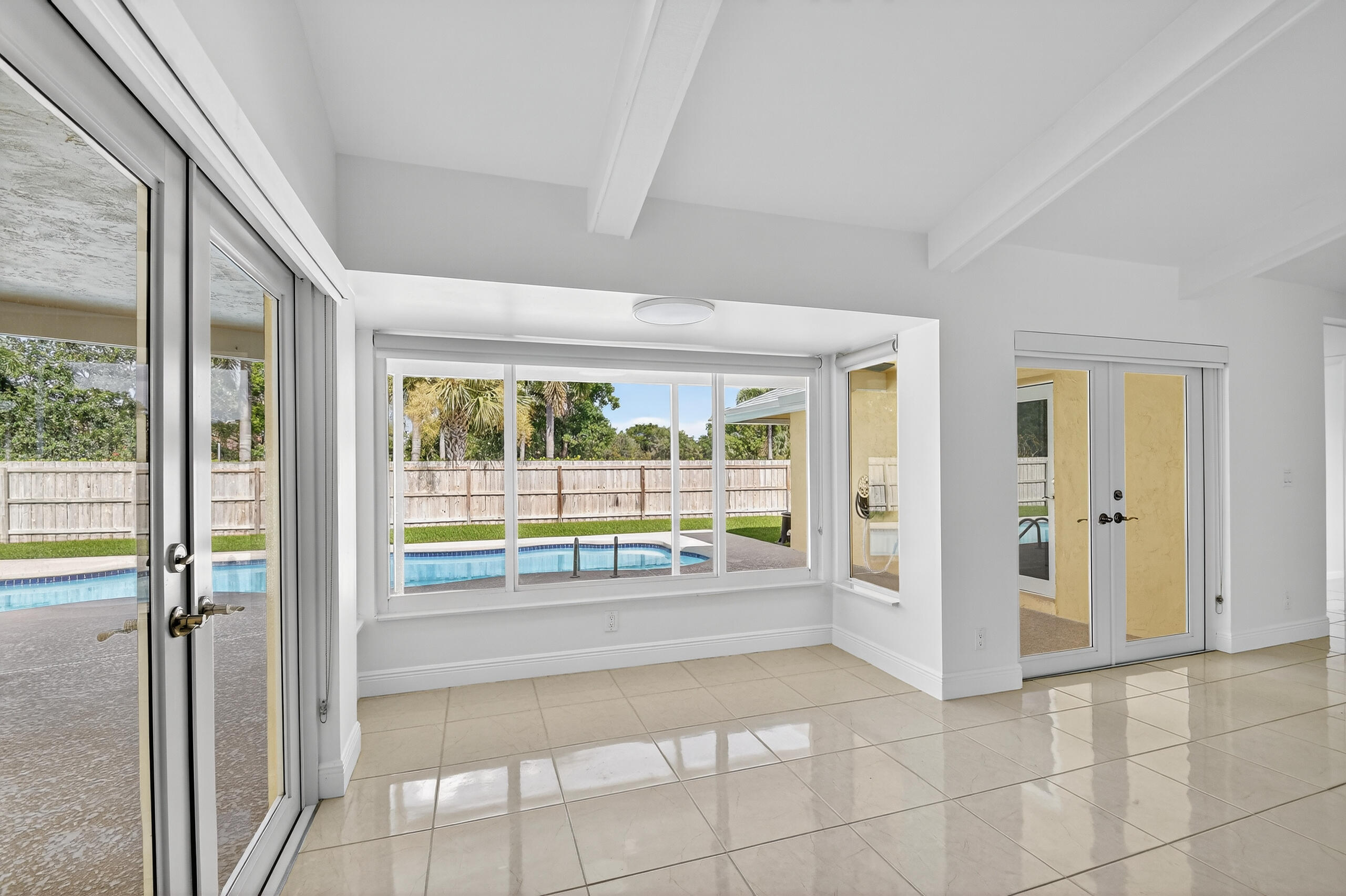 1877 Shower Tree Way Wellington, FL 33414 - Photo 18 of 53 a view of an entryway with a floor to ceiling window