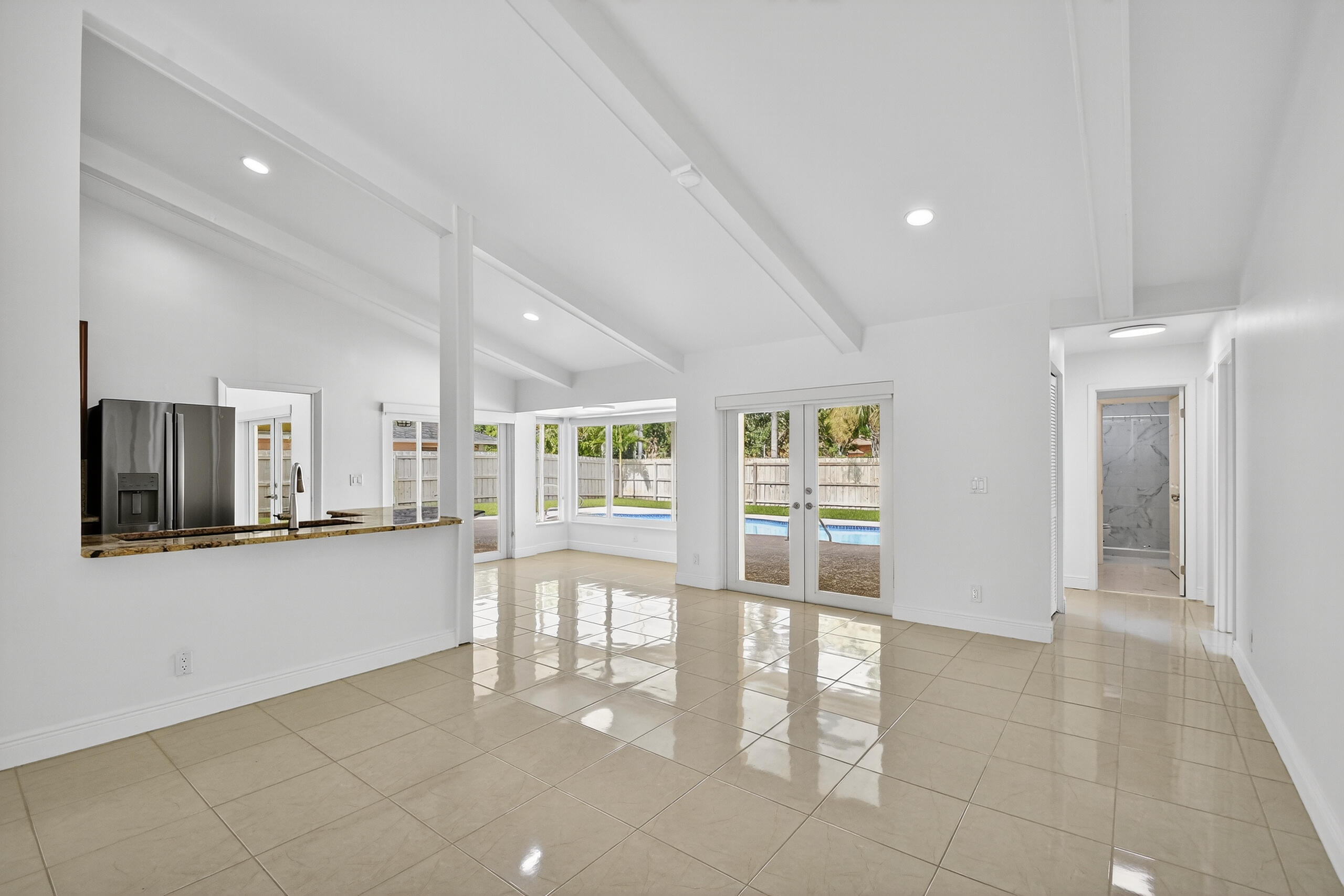 1877 Shower Tree Way Wellington, FL 33414 - Photo 21 of 53 a view of an empty room with glass door