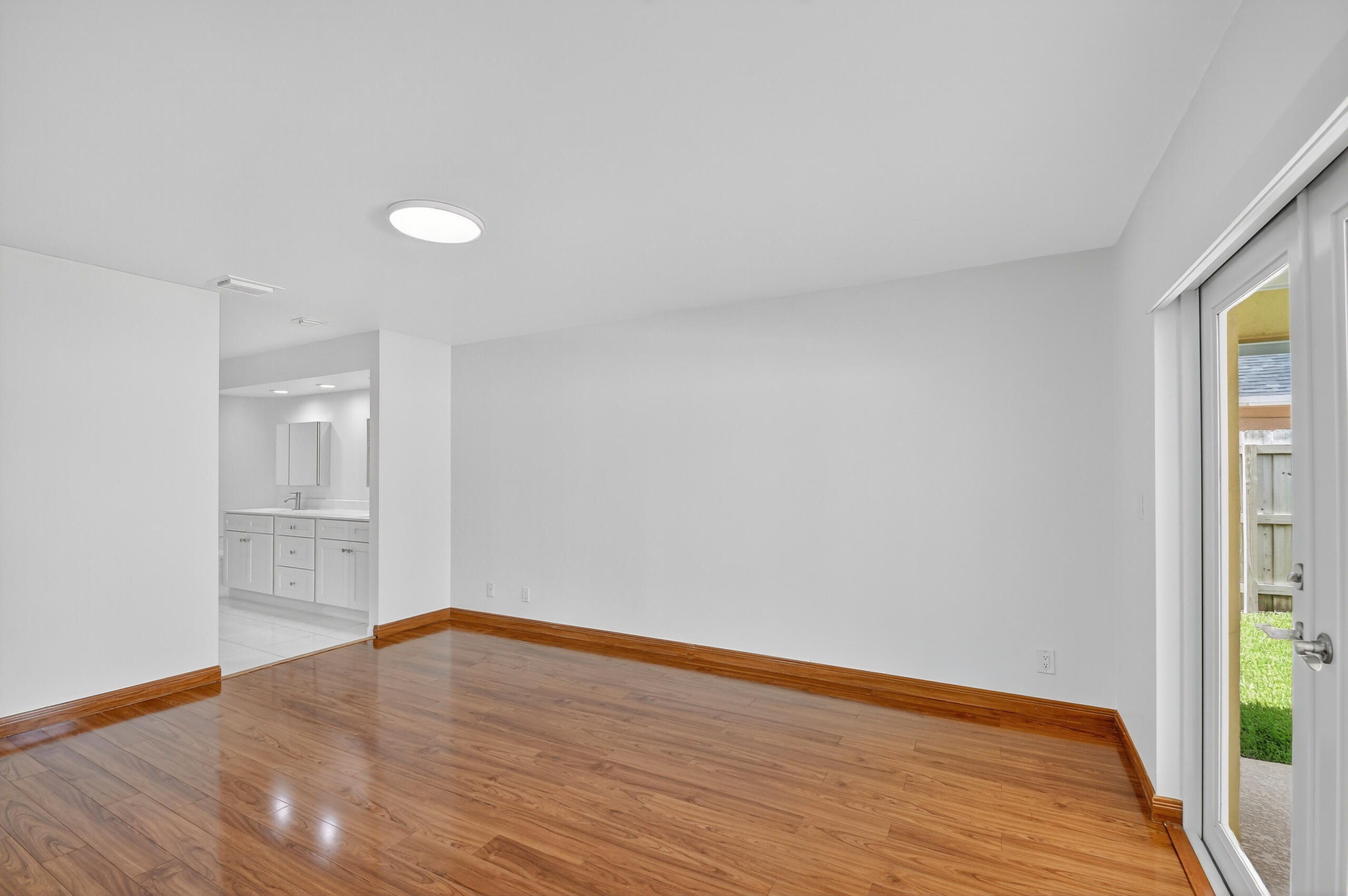 1877 Shower Tree Way Wellington, FL 33414 - Photo 24 of 53 a view of an empty room and wooden floor