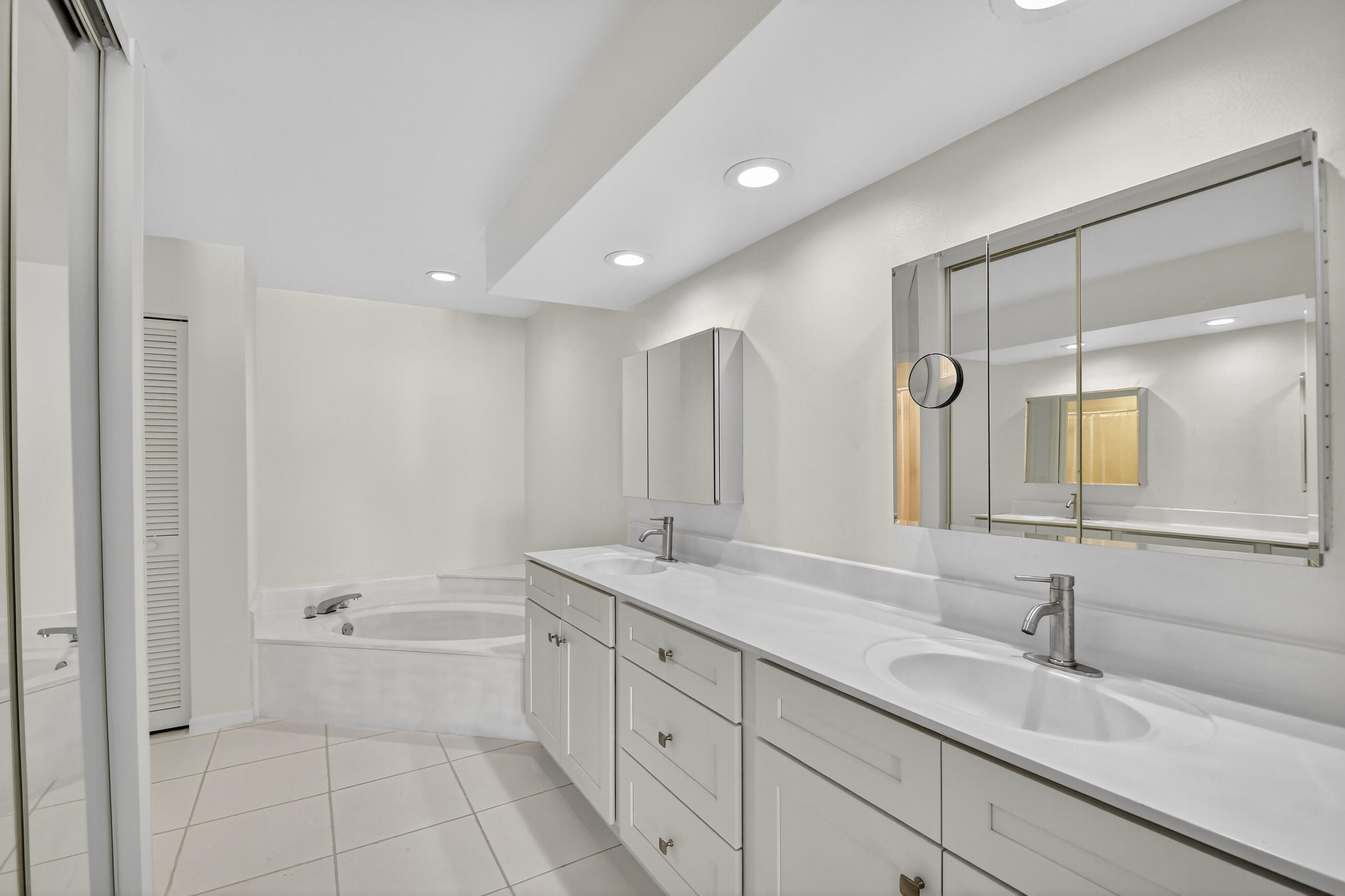 1877 Shower Tree Way Wellington, FL 33414 - Photo 27 of 53 a bathroom with a granite countertop sink mirror and bathtub