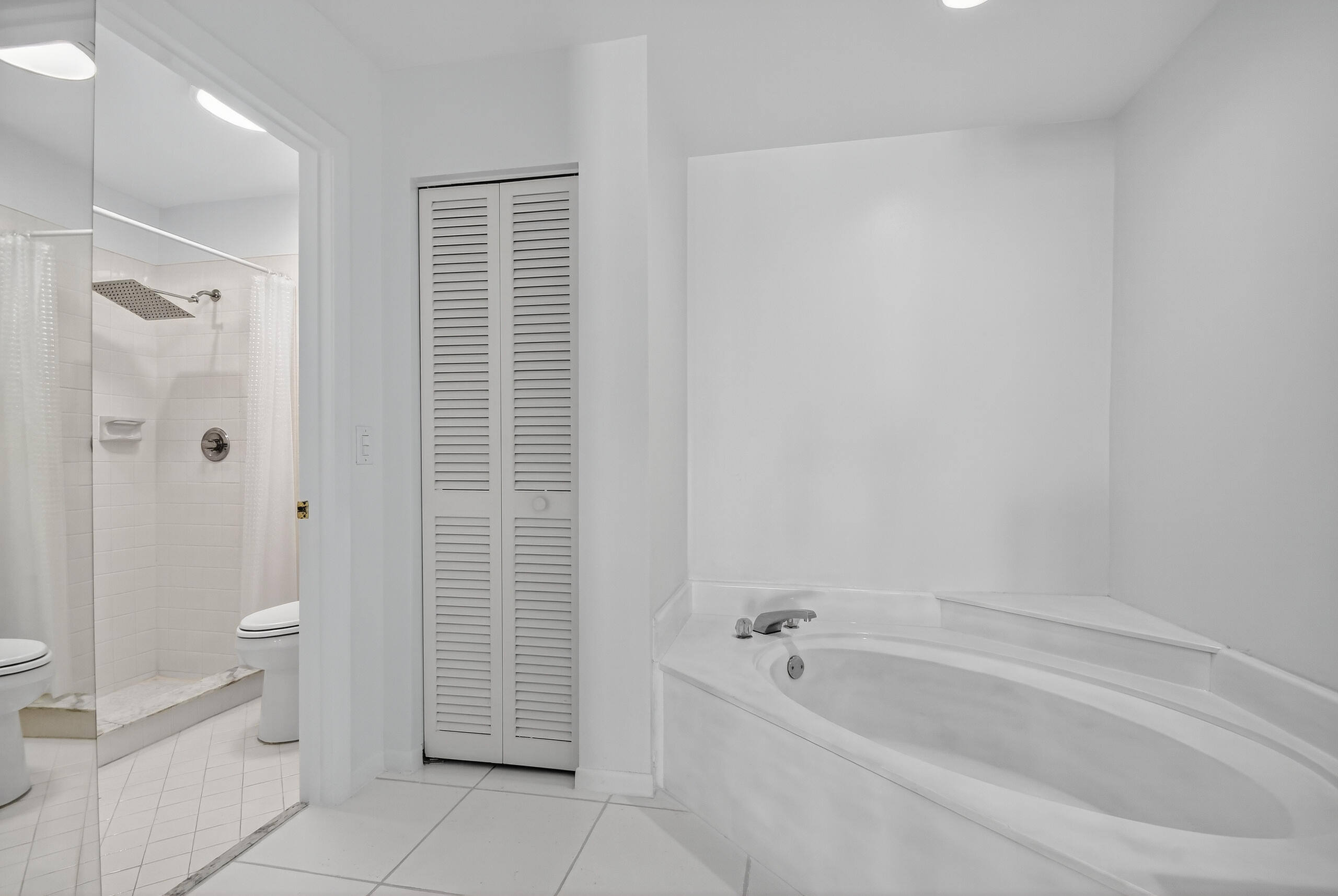 1877 Shower Tree Way Wellington, FL 33414 - Photo 29 of 53 a bathroom with a bathtub and toilet