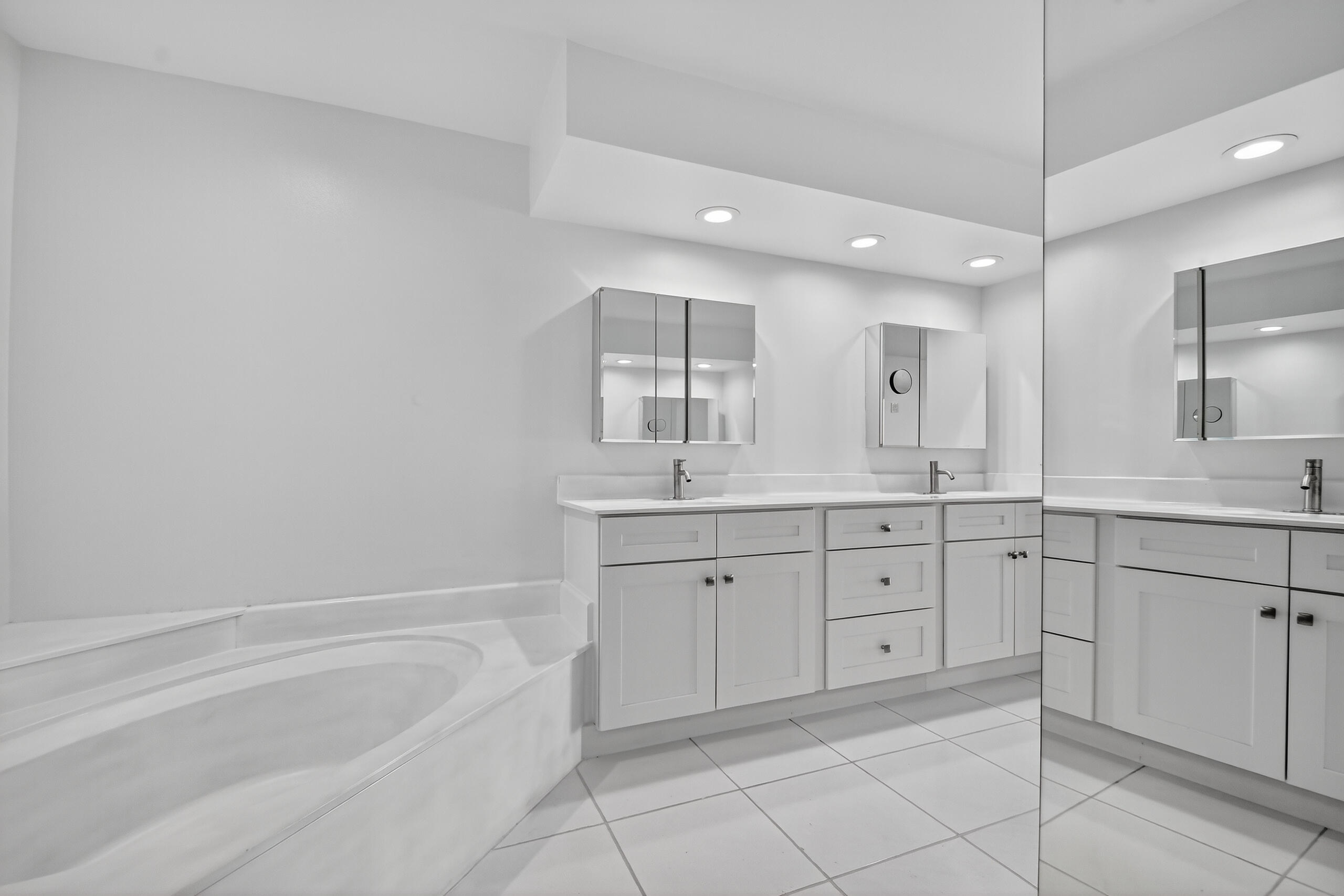 1877 Shower Tree Way Wellington, FL 33414 - Photo 30 of 53 a spacious bathroom with a granite countertop sink mirror and bathtub