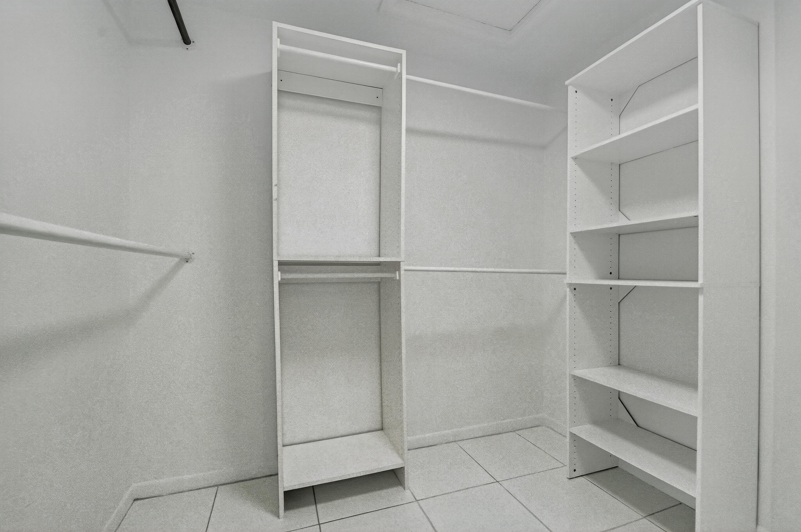 1877 Shower Tree Way Wellington, FL 33414 - Photo 32 of 53 a view of an empty walk in closet