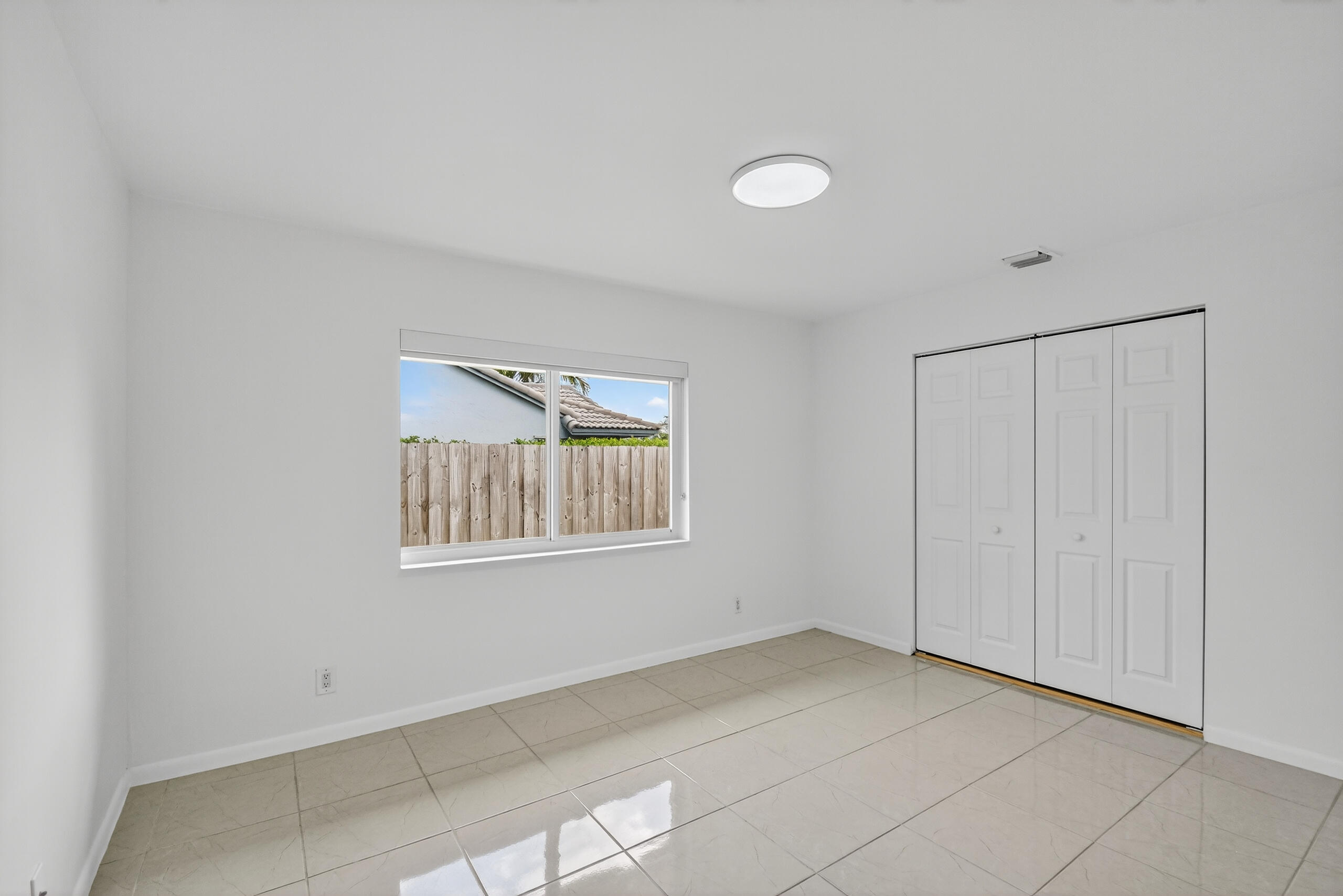 1877 Shower Tree Way Wellington, FL 33414 - Photo 33 of 53 a view of an empty room with a window