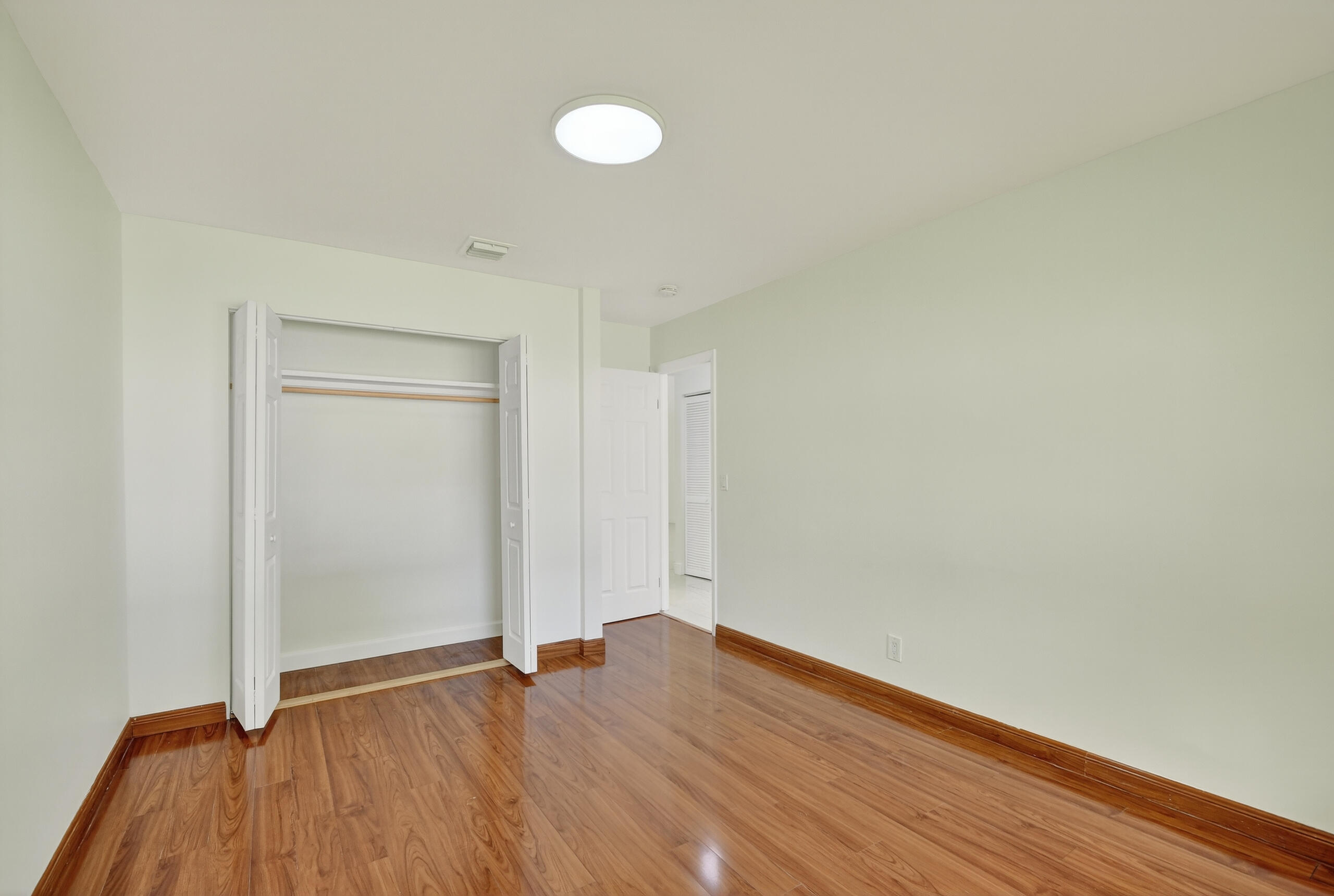 1877 Shower Tree Way Wellington, FL 33414 - Photo 37 of 53 a view of an empty room and wooden floor
