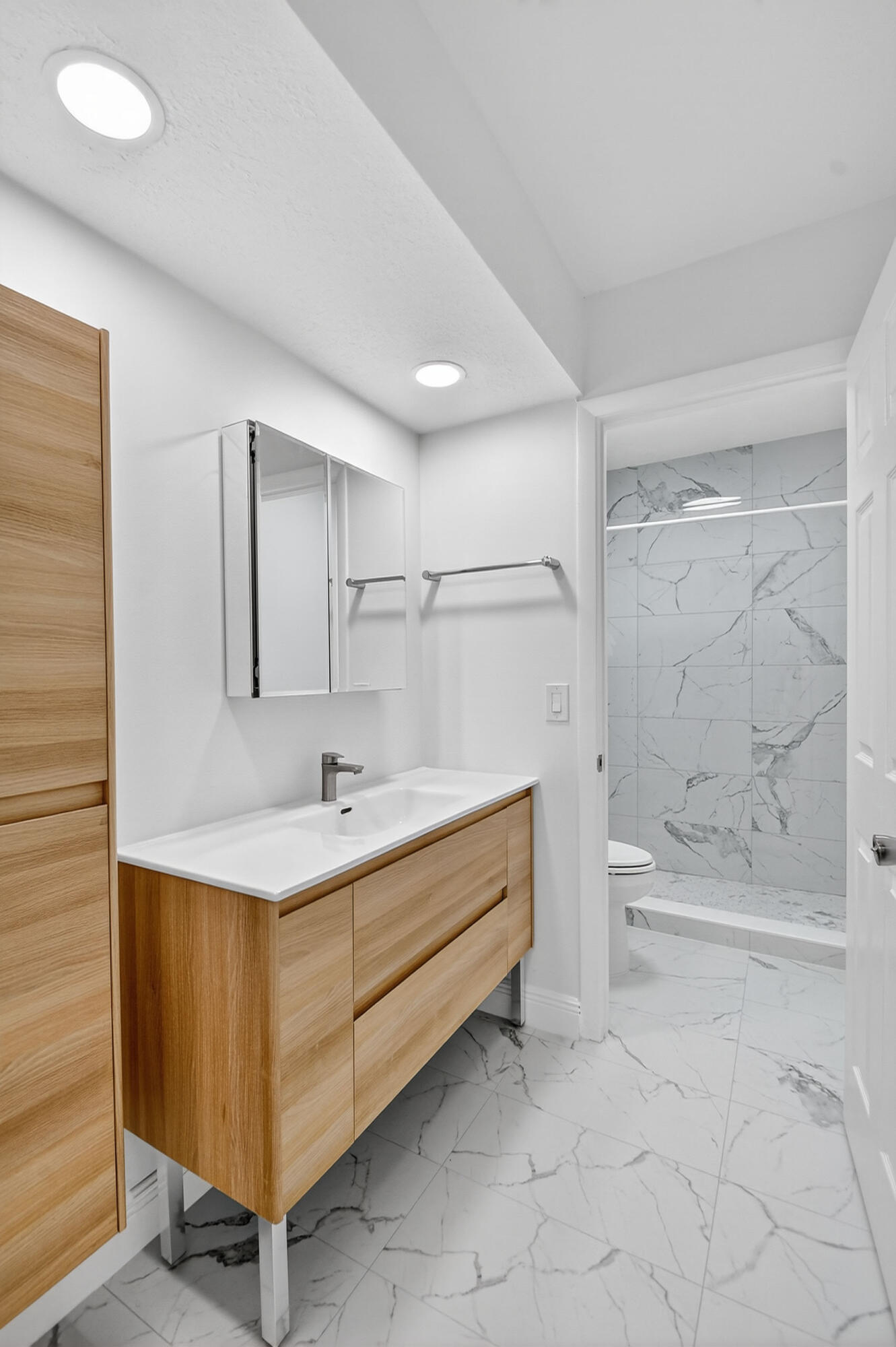 1877 Shower Tree Way Wellington, FL 33414 - Photo 39 of 53 a bathroom with a bathtub sink and toilet