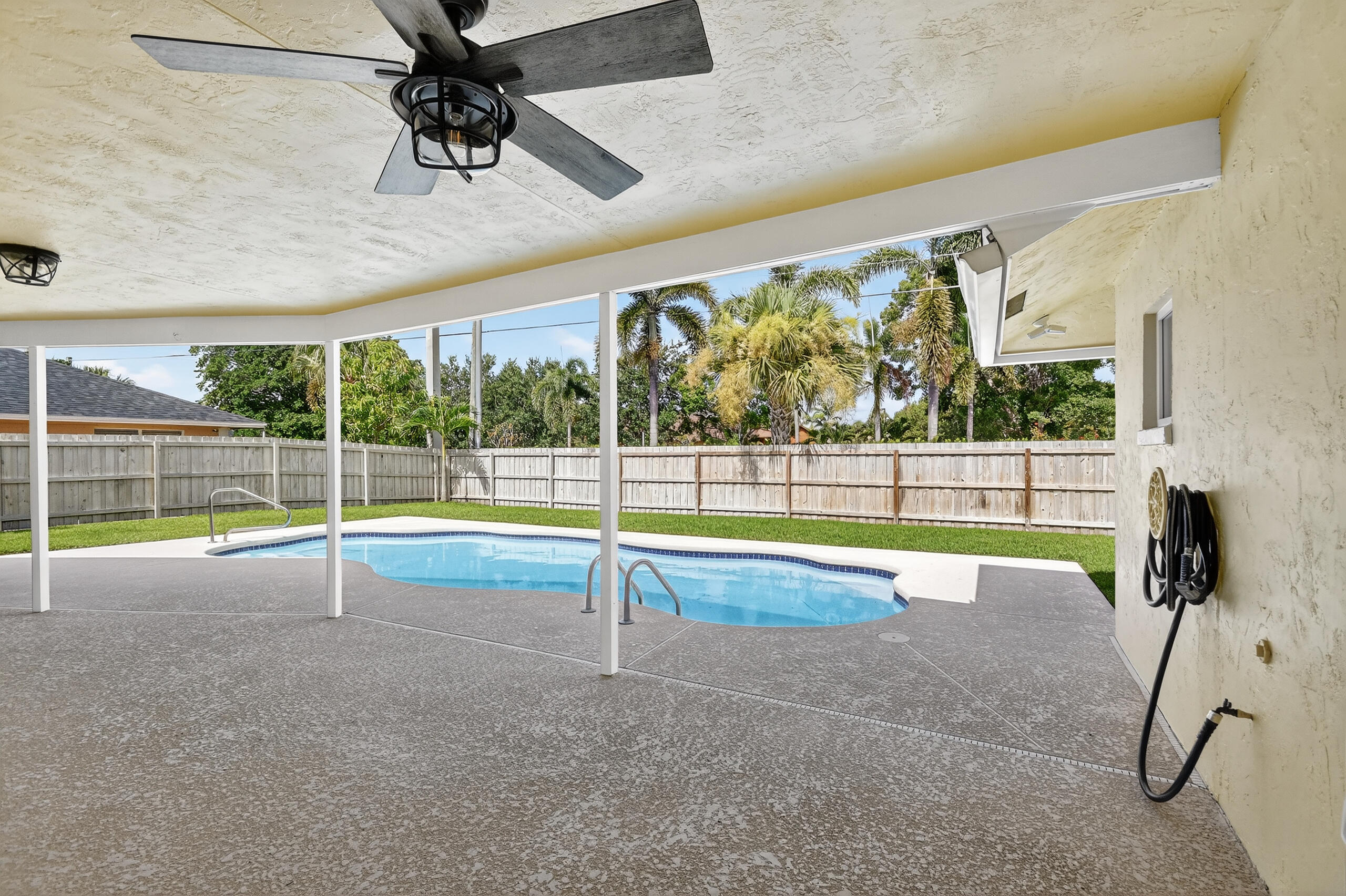 1877 Shower Tree Way Wellington, FL 33414 - Photo 43 of 53 a view of a swimming pool
