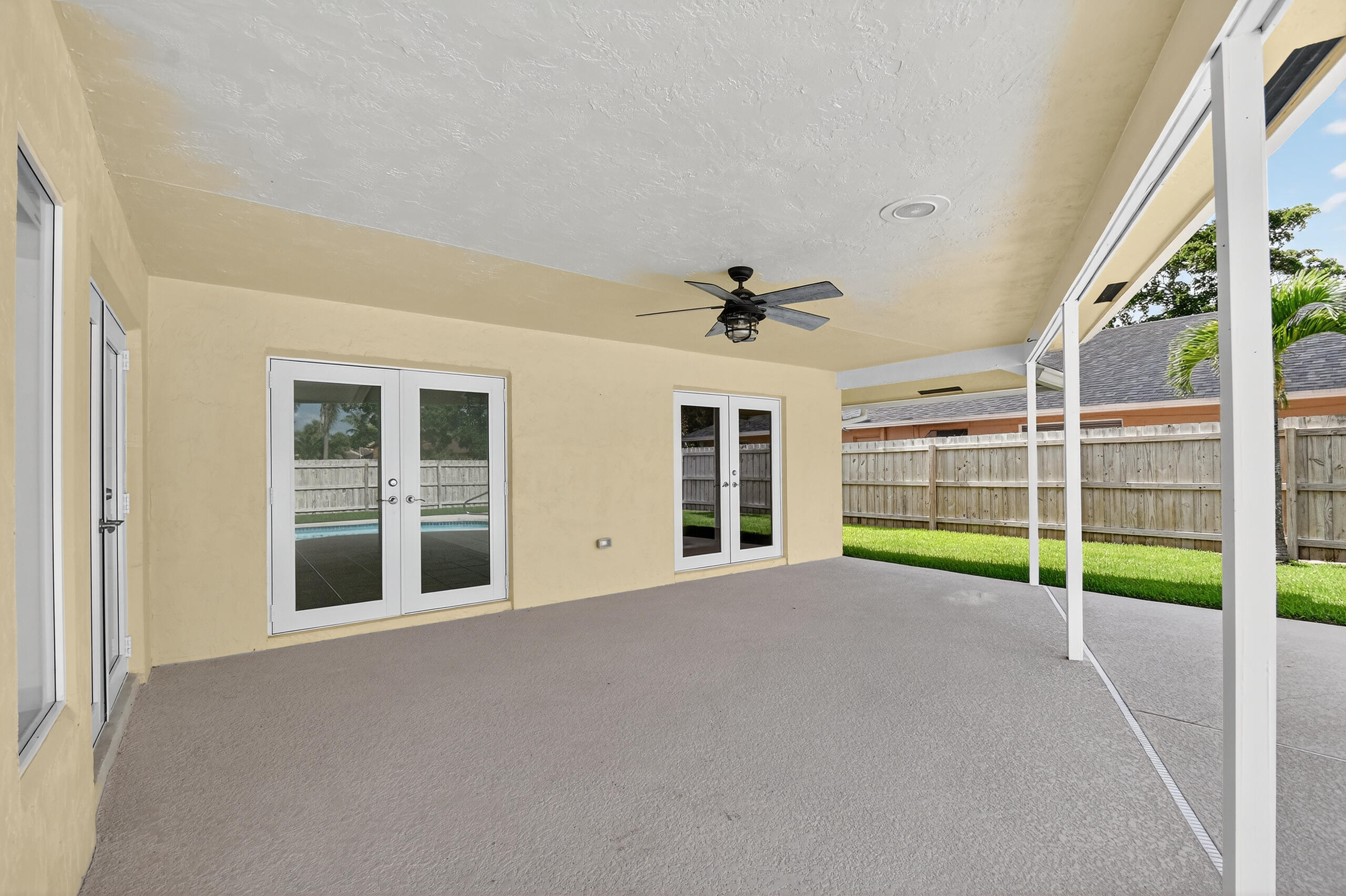 1877 Shower Tree Way Wellington, FL 33414 - Photo 46 of 53 a view of an empty room with a window and balcony
