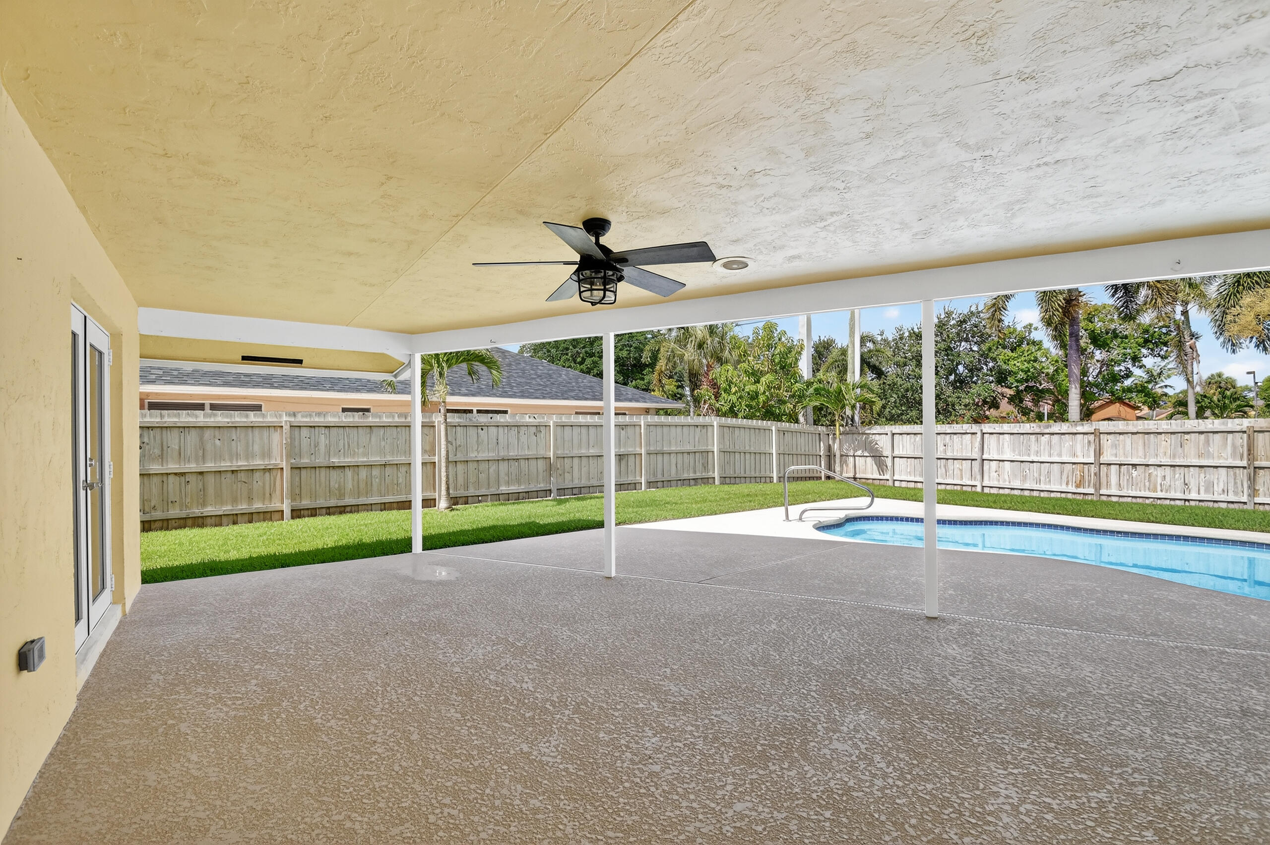 1877 Shower Tree Way Wellington, FL 33414 - Photo 47 of 53 a view of an empty room with a windows and a yard