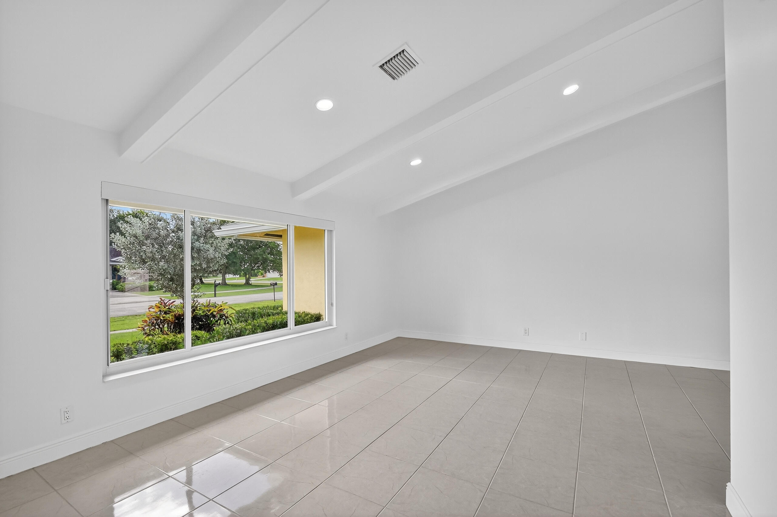 1877 Shower Tree Way Wellington, FL 33414 - Photo 6 of 53 an empty room with windows