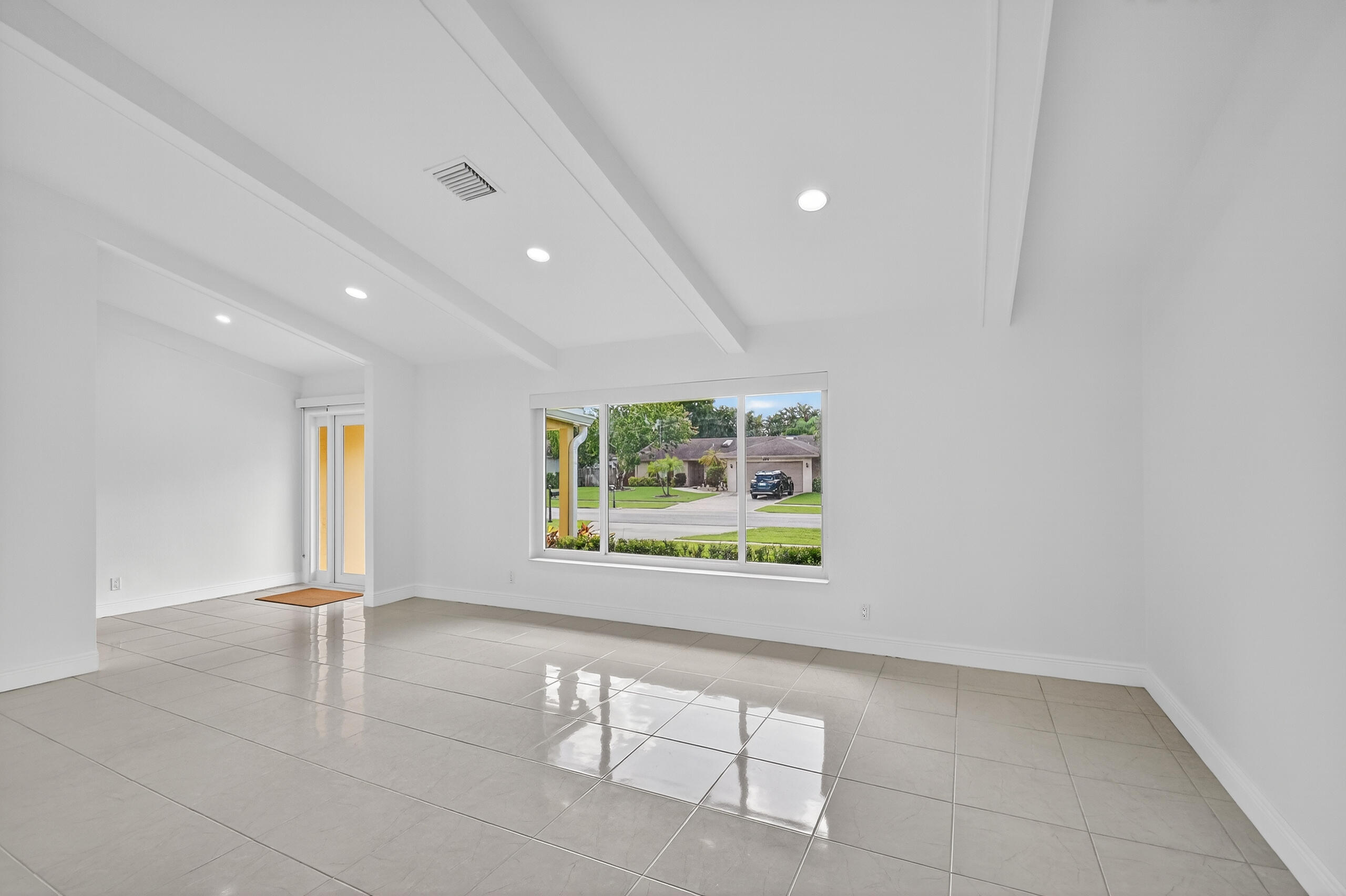 1877 Shower Tree Way Wellington, FL 33414 - Photo 7 of 53 a view of an empty room with a window