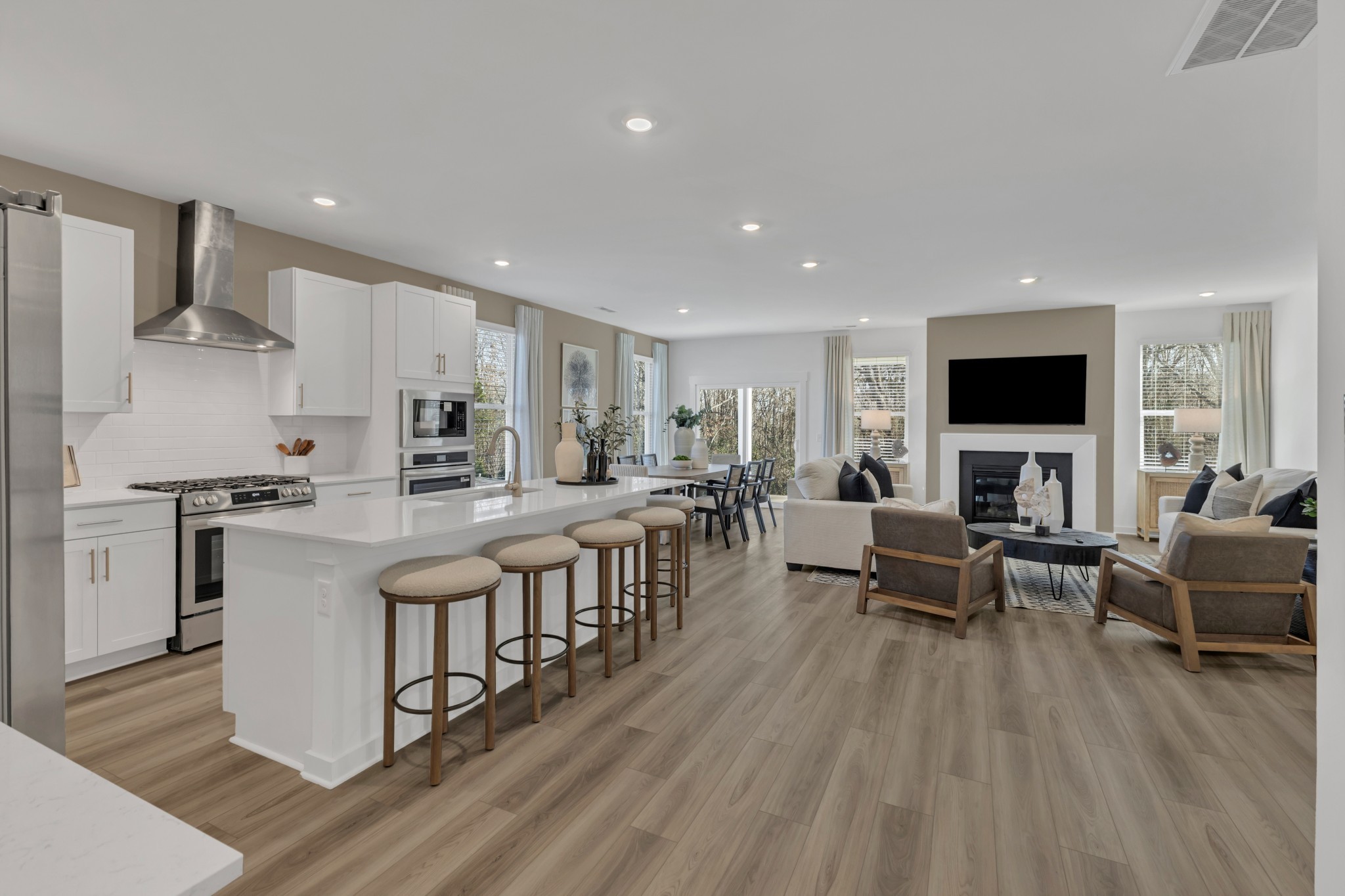 6356 North New Hope Road Hermitage, TN 37076 - Photo 3 of 37 a living room with stainless steel appliances furniture and a flat screen tv