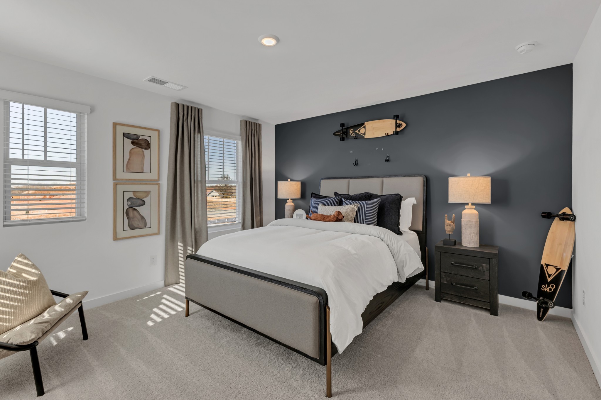 6356 North New Hope Road Hermitage, TN 37076 - Photo 32 of 37 a spacious bedroom with a bed and chair