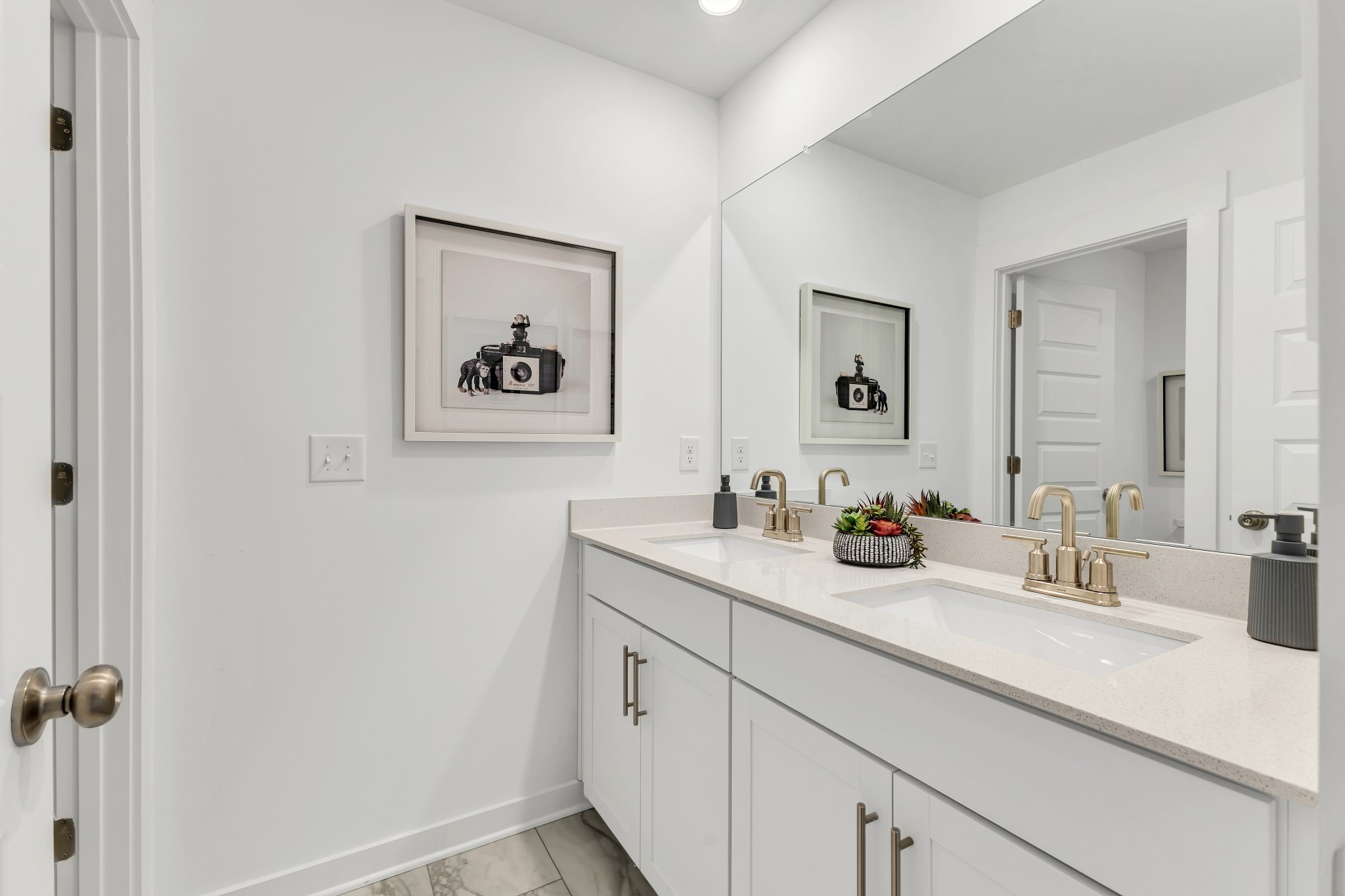 6356 North New Hope Road Hermitage, TN 37076 - Photo 34 of 37 a bathroom with a sink and a mirror