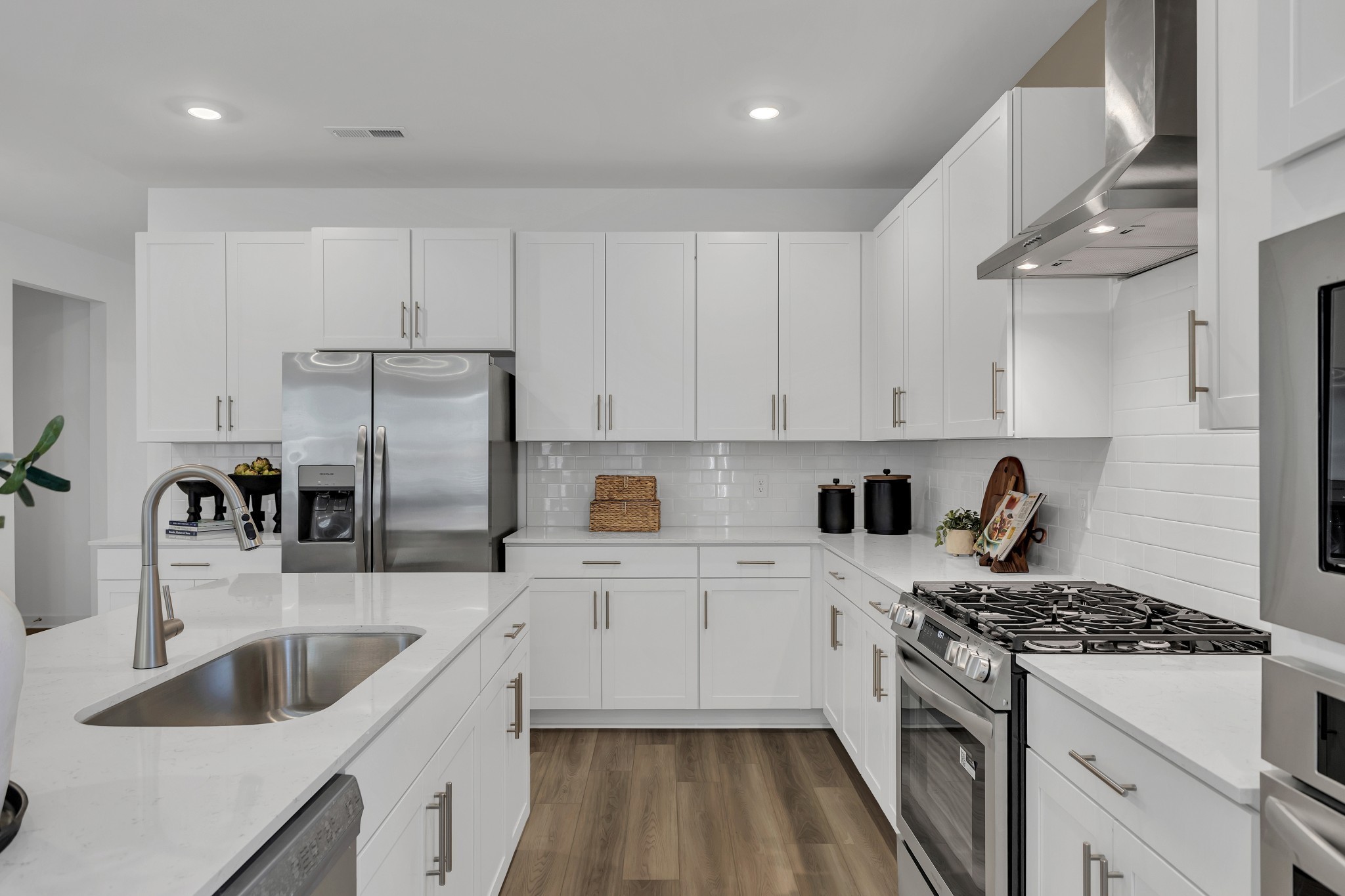 6356 North New Hope Road Hermitage, TN 37076 - Photo 8 of 37 a kitchen with stainless steel appliances granite countertop a sink stove and refrigerator