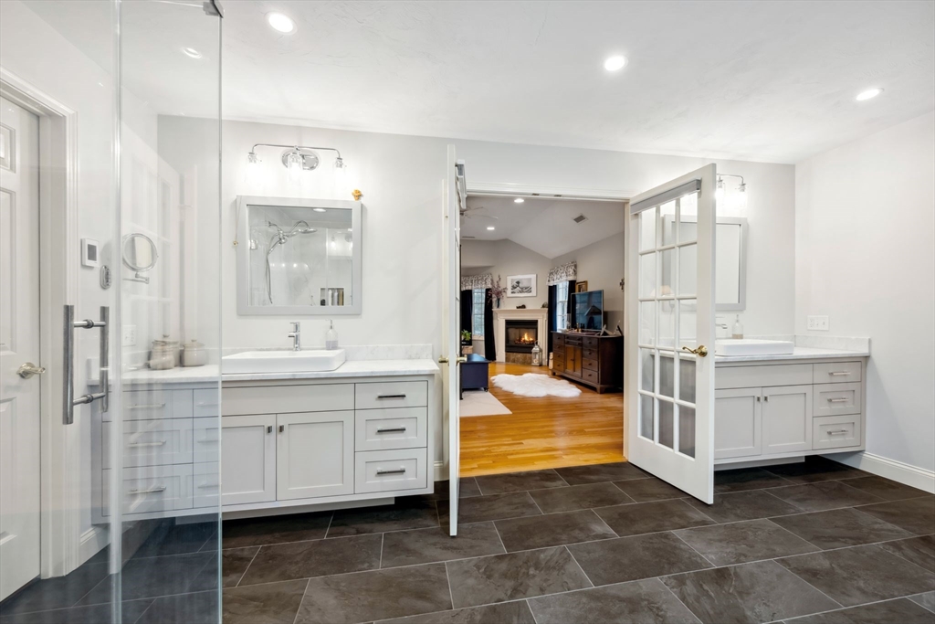 7 Devonshire Road Middleton, MA 01949 - Photo 35 of 42 a bathroom with a double vanity sink mirror and bathtub