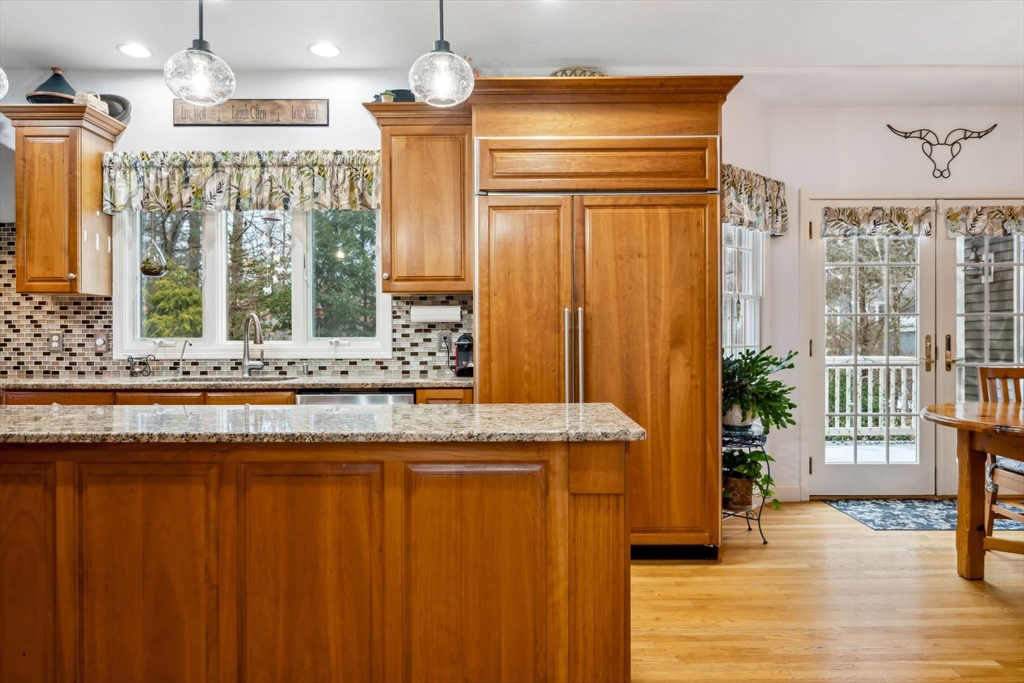 7 Devonshire Road Middleton, MA 01949 - Photo 8 of 42 a view of a kitchen with a sink and wooden floor