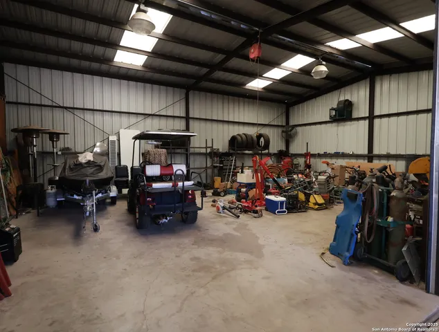 a view of a garage with a bike and car