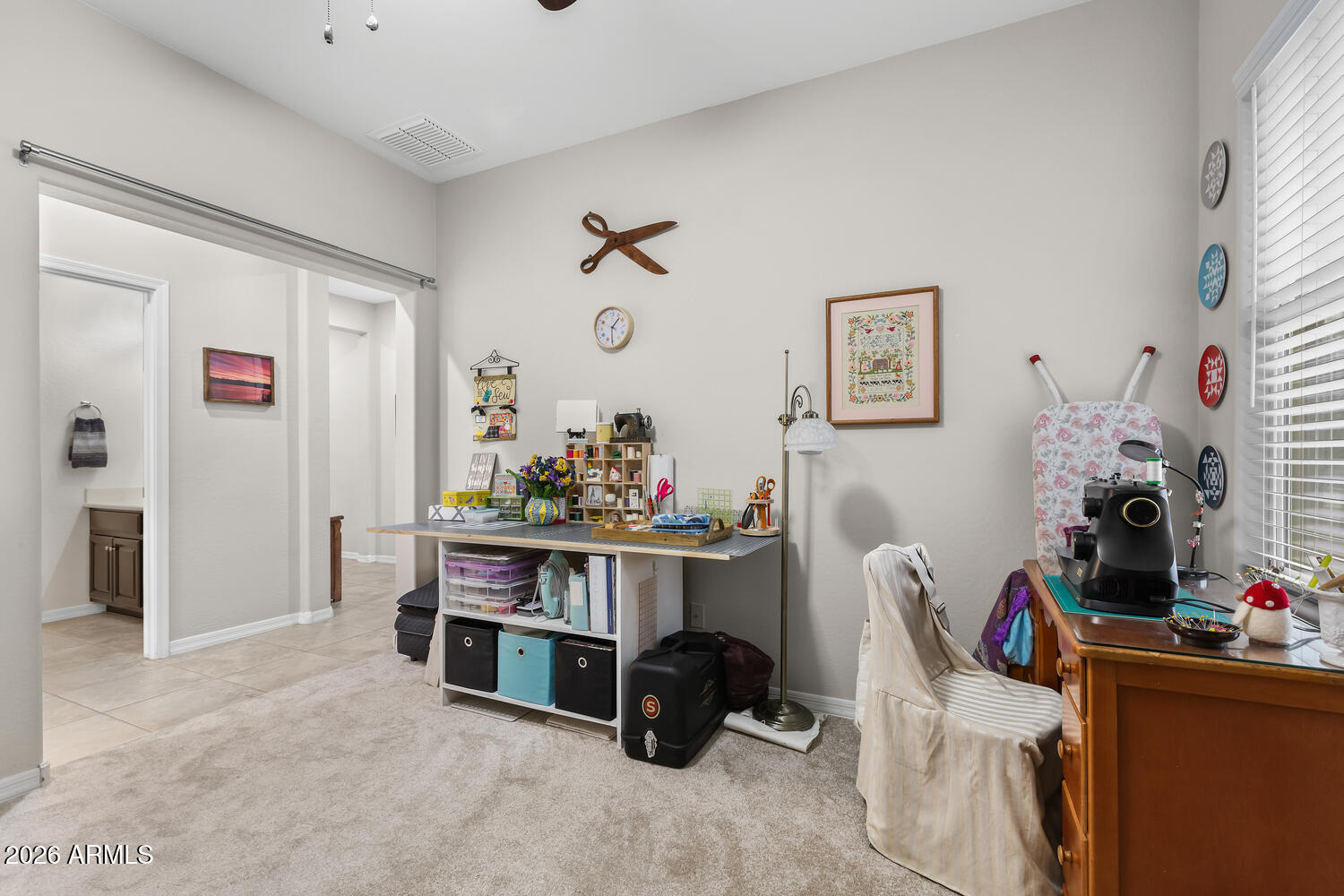 3246 North Springfield Street Buckeye, AZ 85396 - Photo 18 of 27 a view of a workspace with furniture