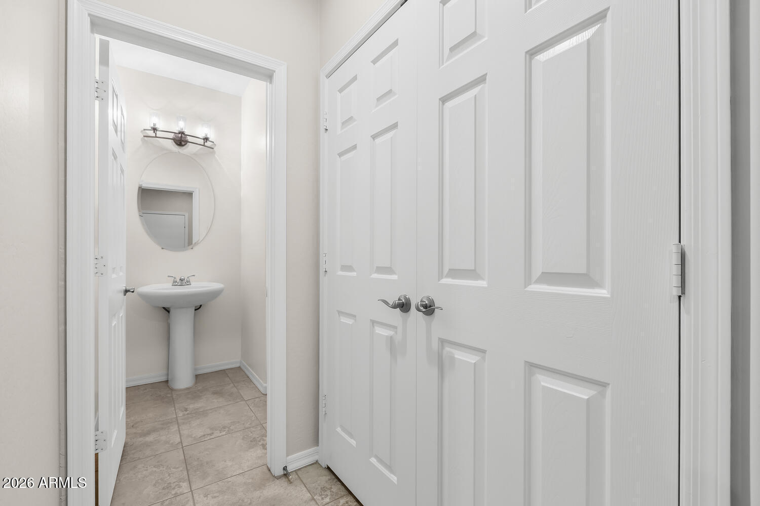 3246 North Springfield Street Buckeye, AZ 85396 - Photo 19 of 27 a bathroom with a sink and a mirror