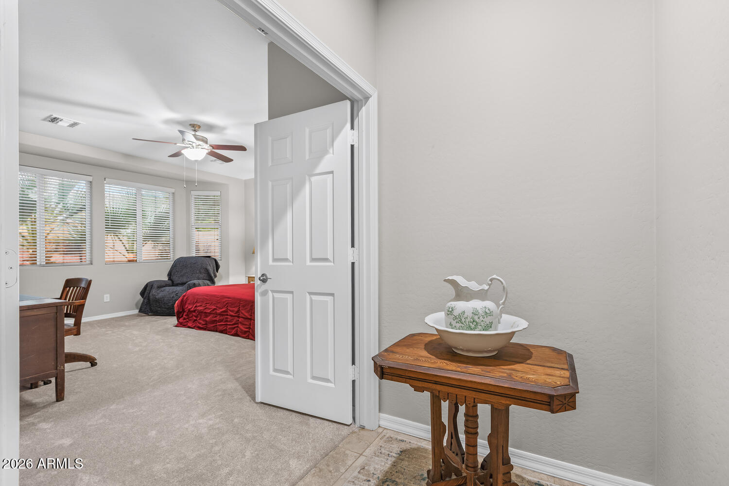 3246 North Springfield Street Buckeye, AZ 85396 - Photo 8 of 27 a bedroom with furniture and a window