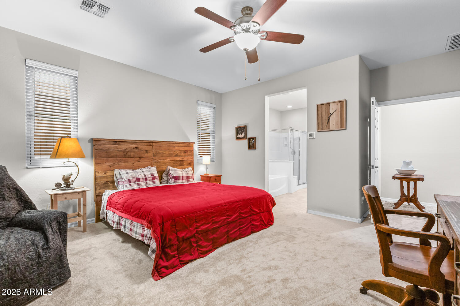 3246 North Springfield Street Buckeye, AZ 85396 - Photo 9 of 27 a bedroom with a bed and a chair