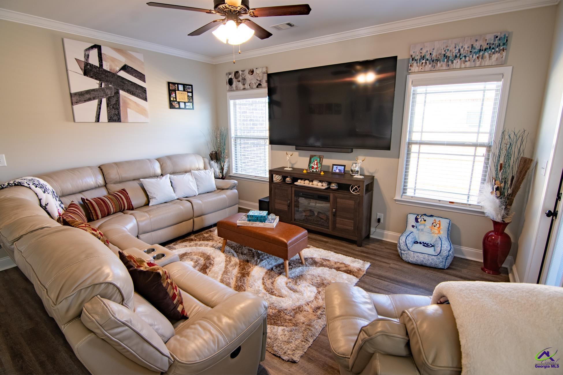 123 Logan's Mill Trail Warner Robins, GA 31093 - Photo 8 of 23 a living room with furniture and a flat screen tv