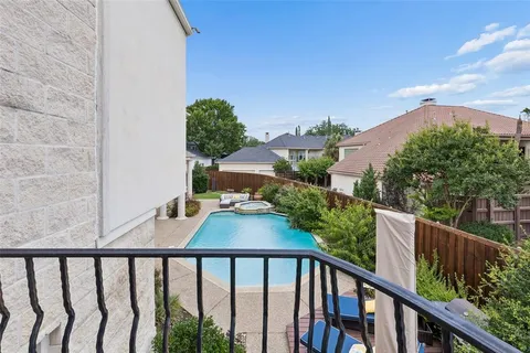 a view of a balcony with wooden fence
