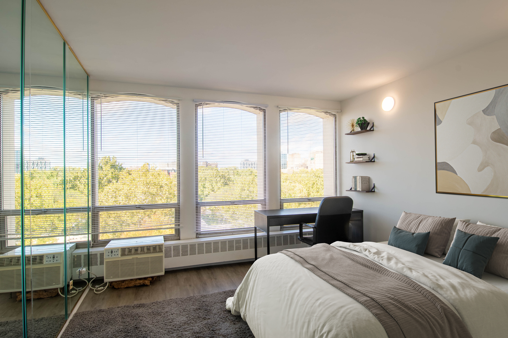 1401 East 55th Street, Unit 701N Chicago, IL 60615 - Photo 6 of 10 a bedroom with a bed and a large window