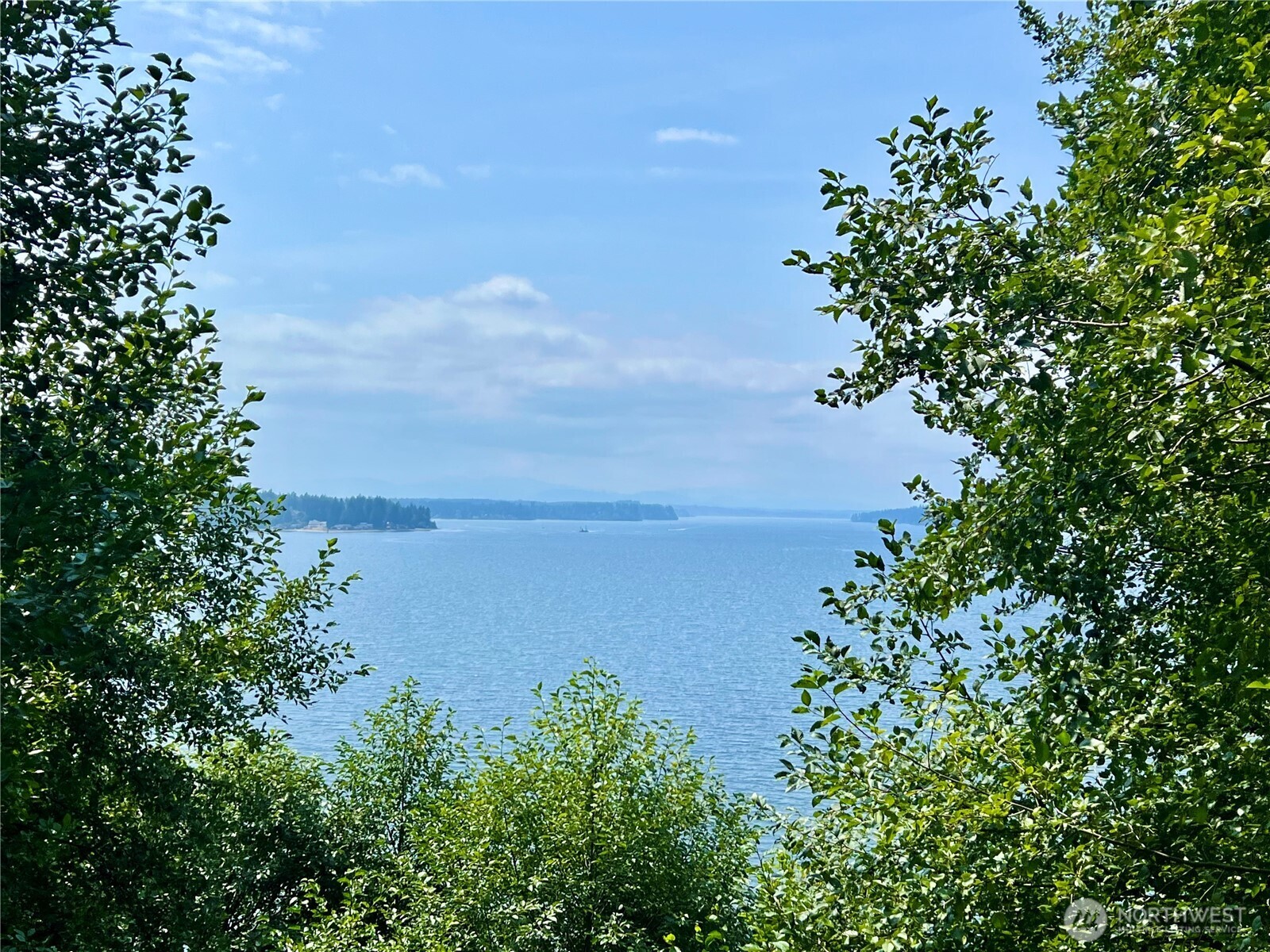 6908 190th Avenue Southwest Longbranch, WA 98351 - Photo 1 of 11 an aerial view of a houses with yard