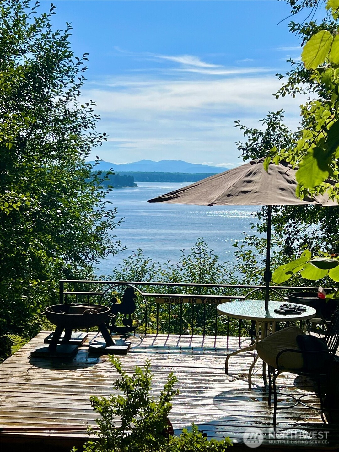 6908 190th Avenue Southwest Longbranch, WA 98351 - Photo 3 of 11 a view of a lake with couches and city view