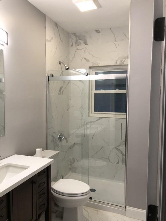 135 Winthrop Street Fall River, MA 02721 - Photo 16 of 26 a bathroom with a shower and sink